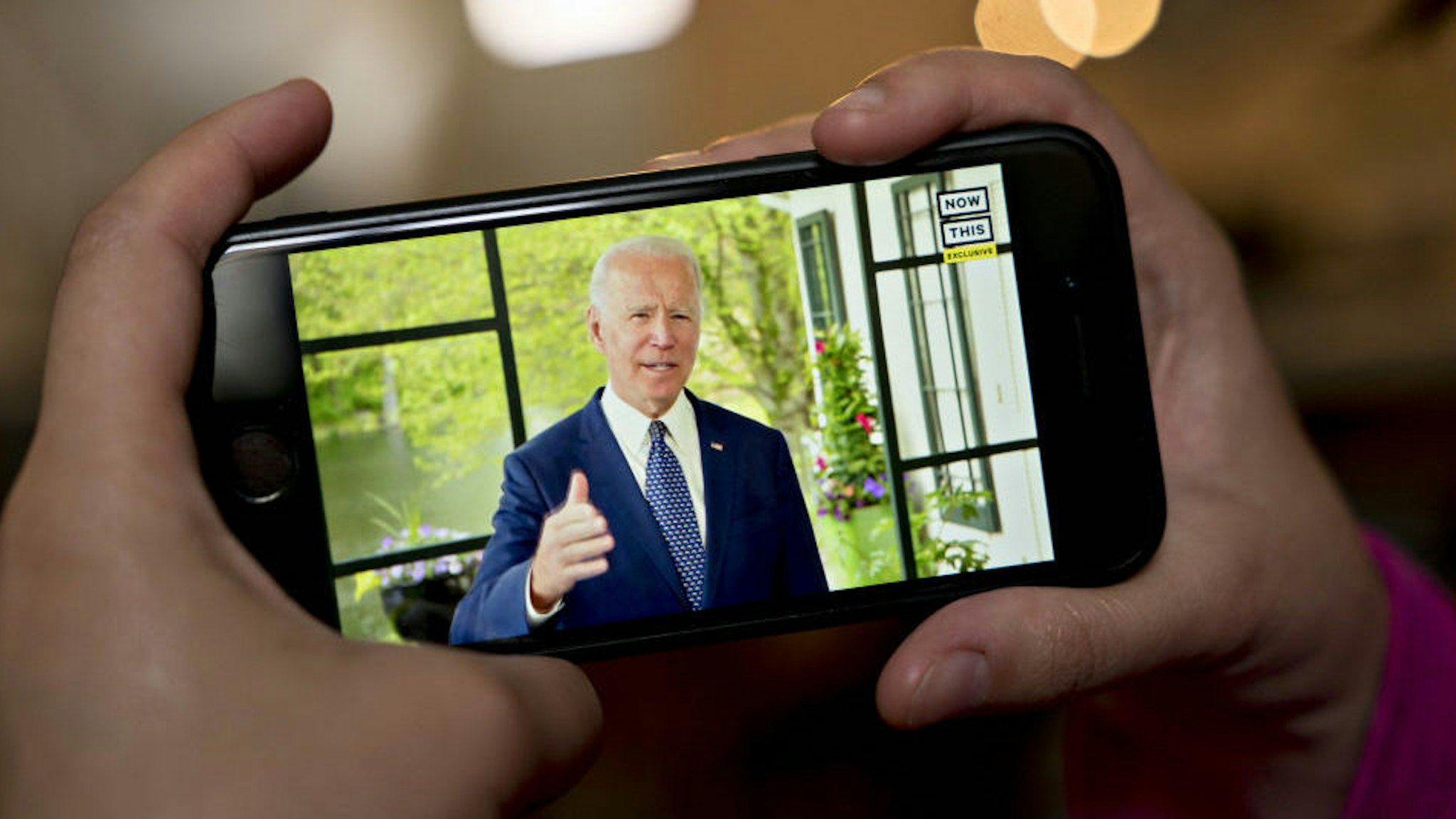 Former Vice President Joe Biden, presumptive Democratic presidential nominee, speaks during a NowThis economic address seen on a smartphone in Arlington, Virginia, U.S., on Friday, May 8, 2020. A super political action committee backing Joe Biden will launch a $10 million television ad campaign touting the presumptive Democratic nominee's leadership on the economic recovery after the 2008 financial crisis. Photographer: Andrew Harrer/Bloomberg