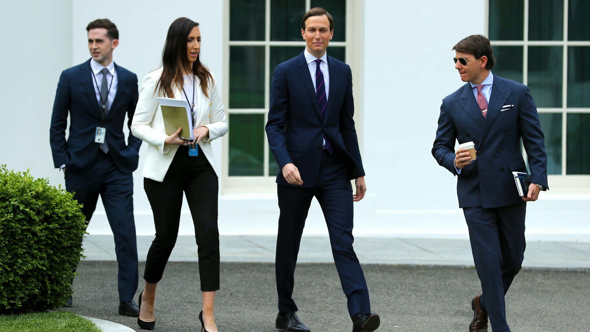 WASHINGTON, DC - MAY 08: (L-R) Assistant to the President and Special Representative for International Negotiations Avi Berkowitz, Special Assistant to the President Alexa Henning, Senior Advisor to President Donald Trump and son-in-law Jared Kushner and White House Deputy Press Secretary Hogan Gidley walk out of the West Wing on the morning that the Labor Department announced that more than 20 million people lost their jobs in April due to the novel coronavirus pandemic May 08, 2020 in Washington, DC. "There is a lot of heartbreak and hardship in those numbers," White House Economic Council Director Larry Kudlow said.