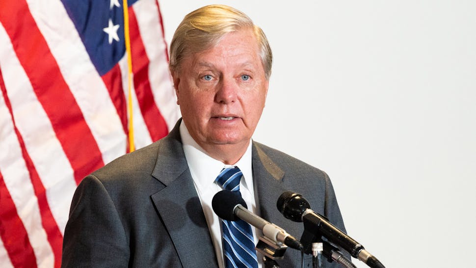 Senate Republicans Walk to and From Their Caucus Launch in Washington, US WASHINGTON, UNITED STATES - MAY 12, 2020: U.S. Senator Lindsey Graham (R-SC) speaks to the media on his way to the Republican caucus launch.
