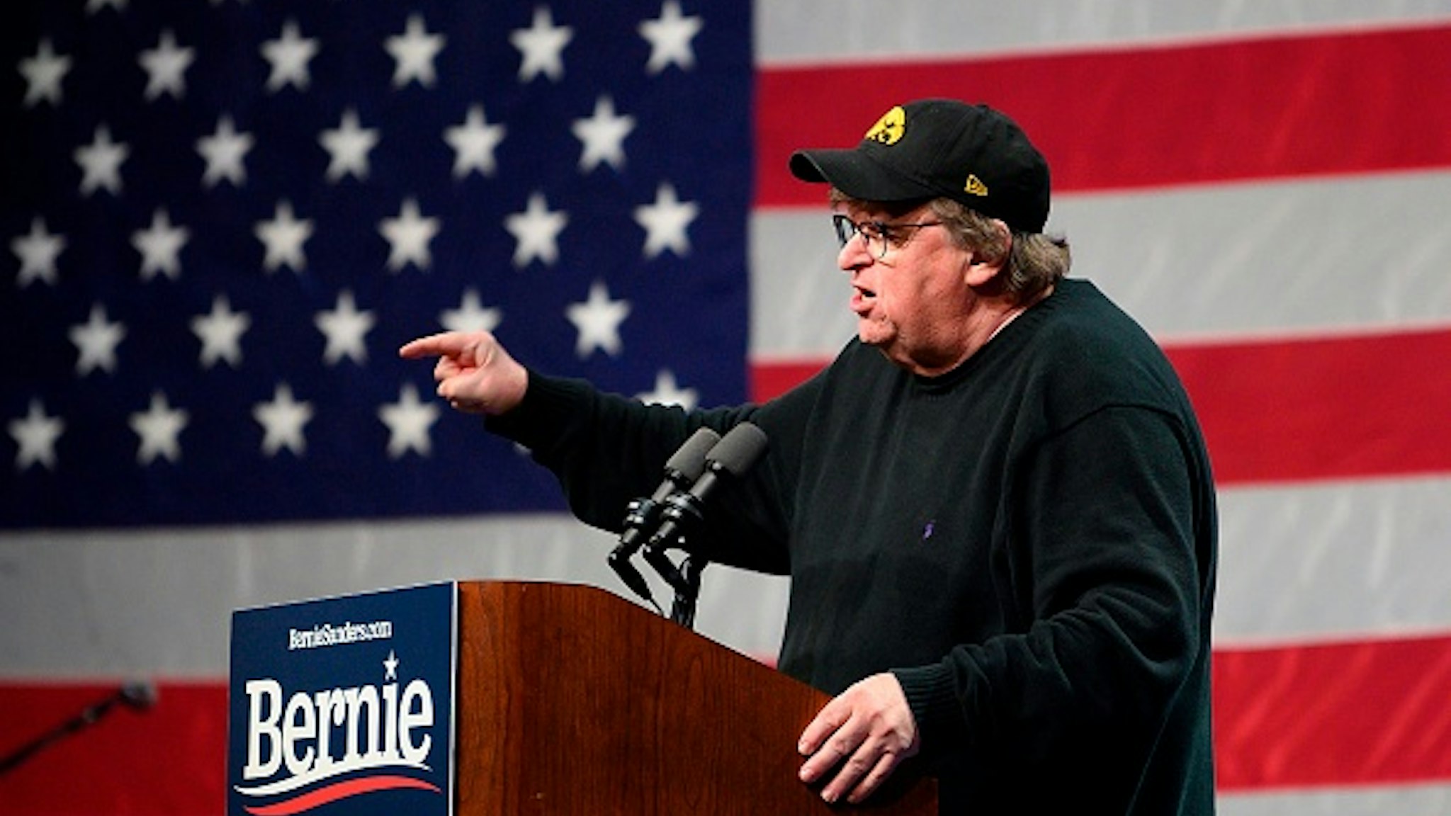 US filmmaker-author-activist Michael Moore, speaks to supporters of Democratic presidential candidate Senator Bernie Sanders at a campaign event in Clive, Iowa, on January 31, 2020.