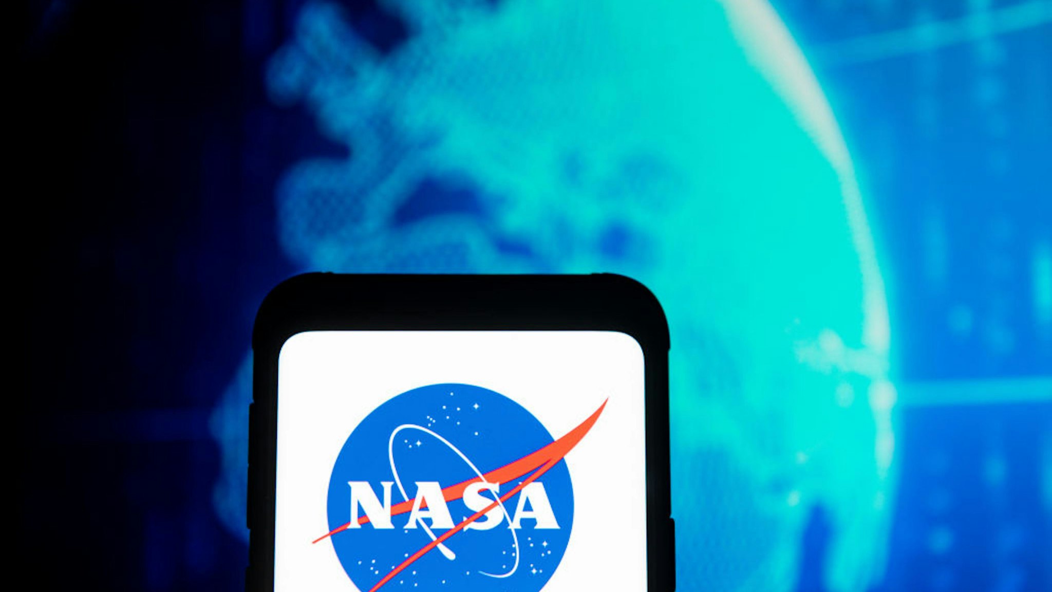 POLAND - 2020/03/23: In this photo illustration a NASA logo seen displayed on a smartphone.
