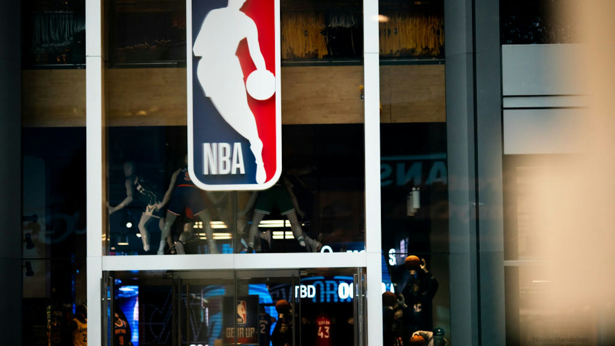 NEW YORK, NY - MARCH 12: An NBA logo is shown at the 5th Avenue NBA store on March 12, 2020 in New York City. The National Basketball Association said they would suspend all games after player Rudy Gobert of the Utah Jazz reportedly tested positive for the Coronavirus (COVID-19