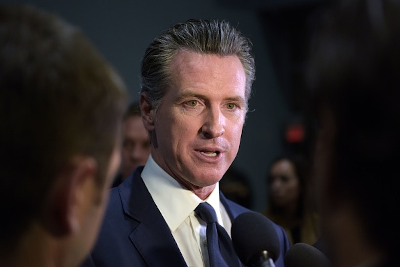 California Governor Gavin Newsom speaks to the press in the spin room after the sixth Democratic primary debate of the 2020 presidential campaign season co-hosted by PBS NewsHour & Politico at Loyola Marymount University in Los Angeles, California on December 19, 2019.