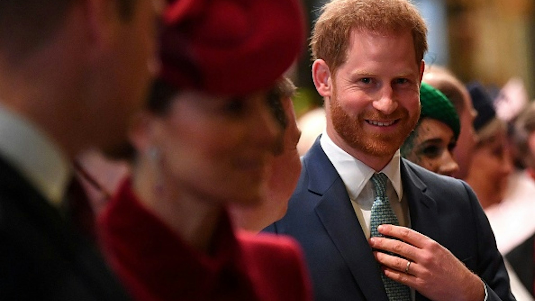 Britain's Prince Harry, Duke of Sussex (C) is introduced to performers as he leaves with Britain's Prince William, Duke of Cambridge (L) and Britain's Catherine, Duchess of Cambridge (2L) after attending the annual Commonwealth Service at Westminster Abbey in London on March 09, 2020. - Britain's Queen Elizabeth II has been the Head of the Commonwealth throughout her reign. Organised by the Royal Commonwealth Society, the Service is the largest annual inter-faith gathering in the United Kingdom.