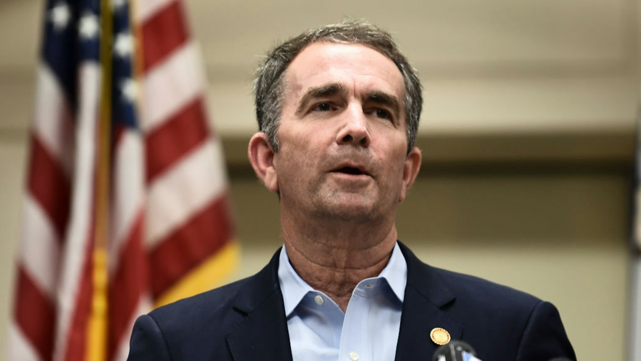 Virginia Governor Ralph Northam speaks to the press about a mass shooting on June 1, 2019, in Virginia, Beach, Virginia. - A municipal employee sprayed gunfire "indiscriminately" in a government building complex on May 31, 2019, police said, killing 12 people and wounding four in the latest mass shooting to rock the US. (Photo by Eric BARADAT / AFP) (Photo credit should read ERIC BARADAT/AFP via Getty Images)