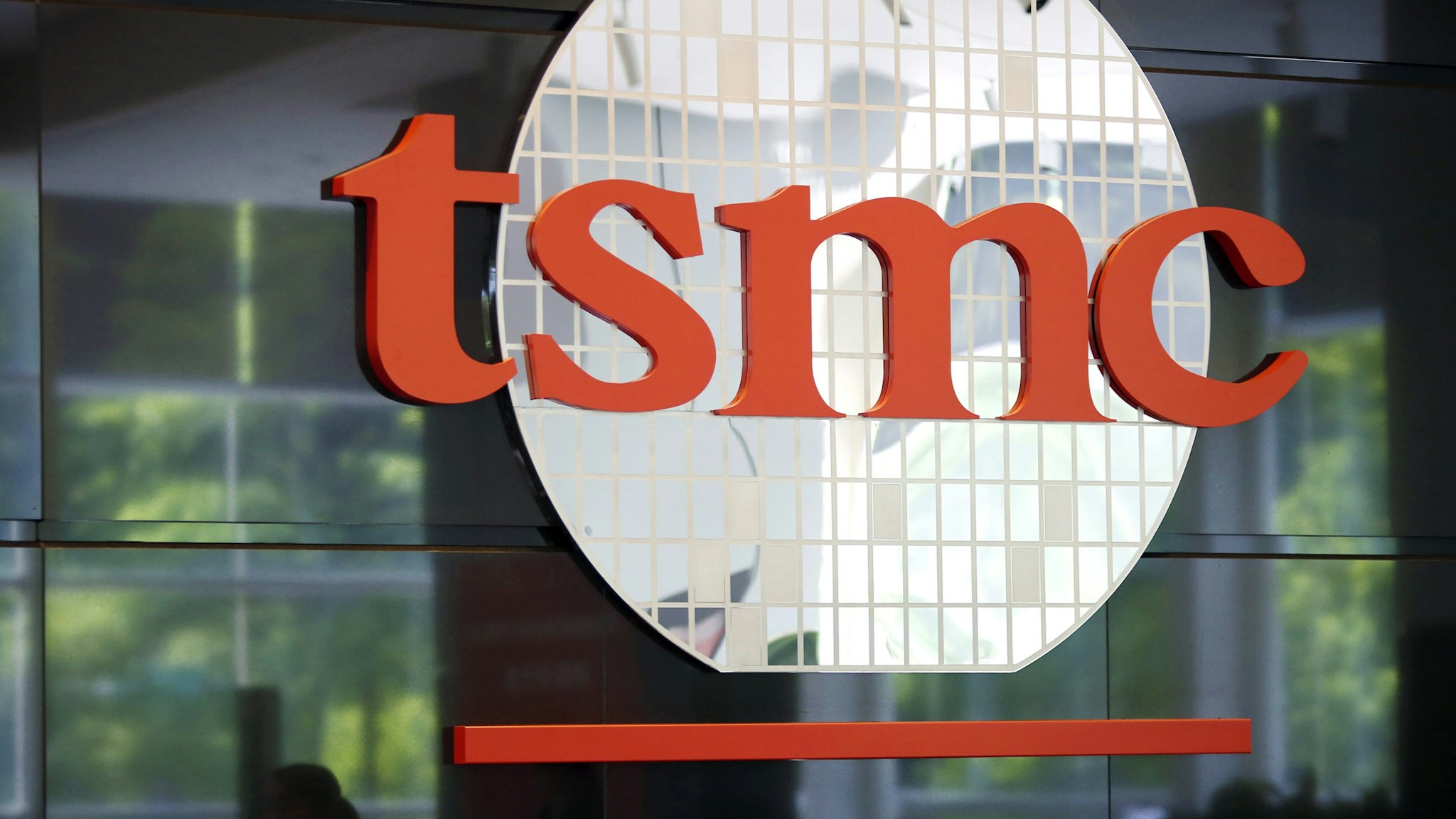 Signage for Taiwan Semiconductor Manufacturing Co. (TSMC) is displayed at the company's headquarters in Hsinchu, Taiwan, on Wednesday, June 5, 2019. TSMC Chairman Mark Liu didn't reaffirm a previous forecast that the company will grow slightly in 2019, saying uncertainty was too great at the moment.