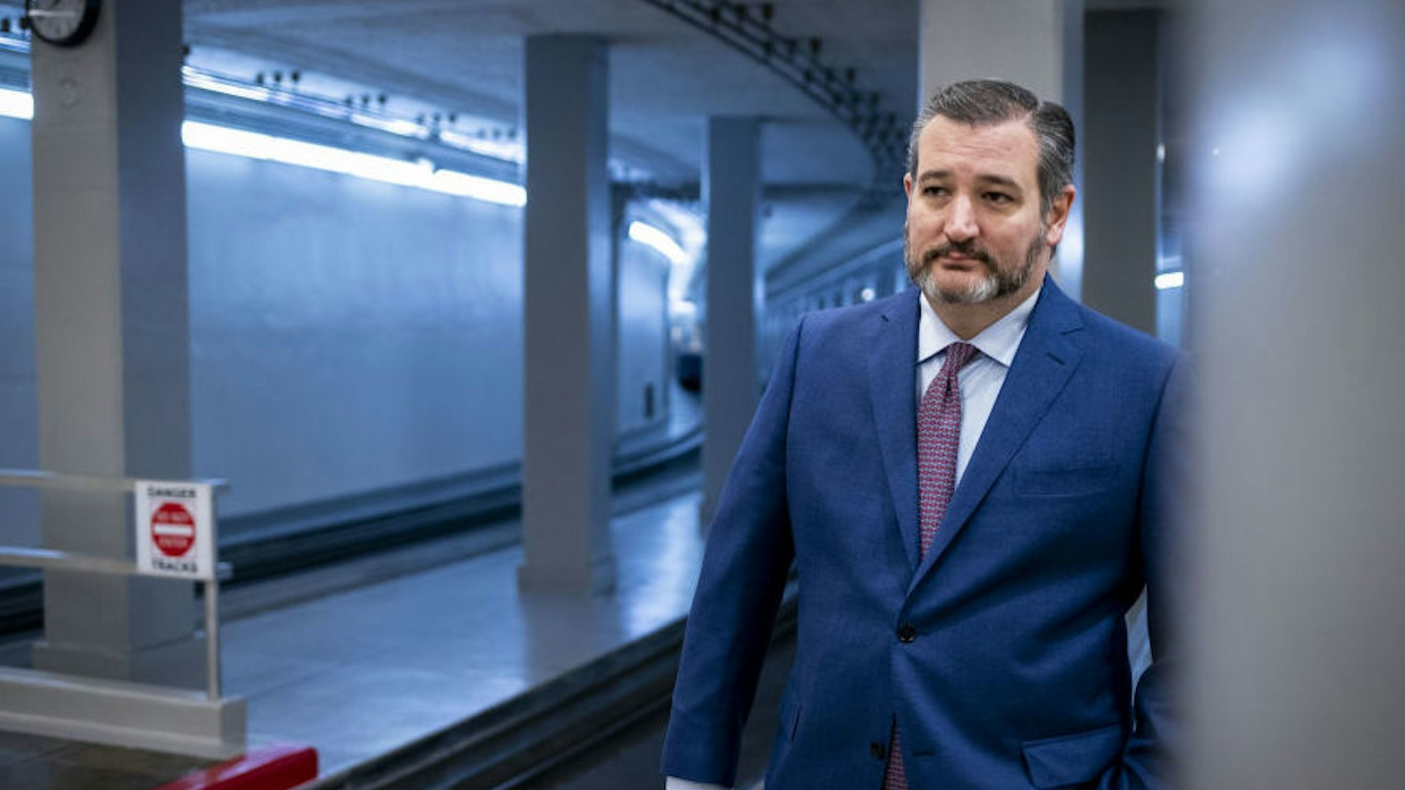 Senator Ted Cruz, a Republican from Texas, arrives for a vote in the Senate Subway of the U.S. Capitol in Washington, D.C., U.S., on Monday, March 23, 2020. Senate Democrats again refused to advance Mitch McConnell's $2 trillion stimulus plan Monday as the coronavirus continued spreading amid dire predictions of a deep economic recession. Photographer: Al Drago/Bloomberg