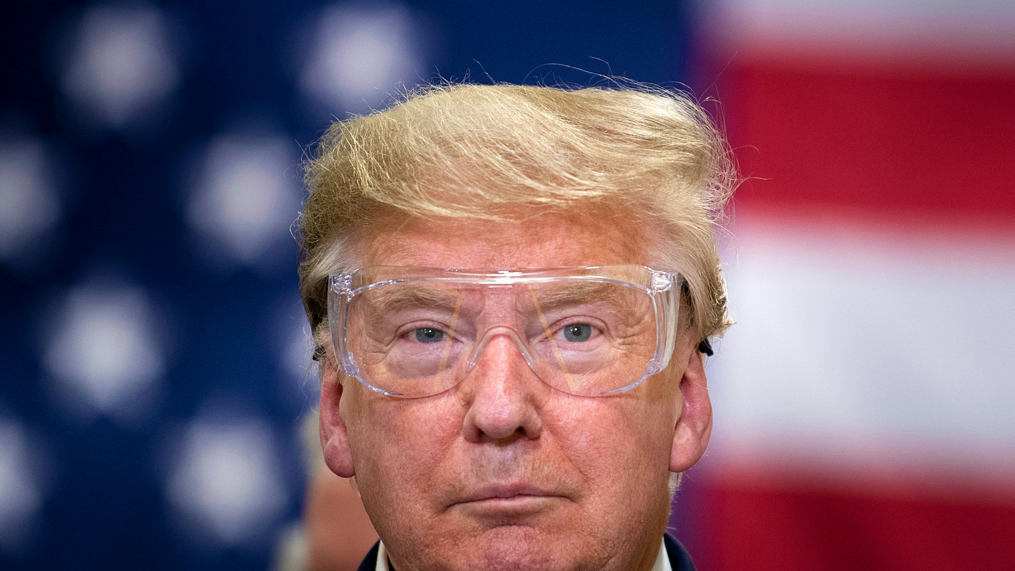 US President Donald Trump tours a Honeywell International Inc. factory producing N95 masks during his first trip since widespread COVID-19 related lockdowns went into effect May 5, 2020, in Phoenix, Arizona.