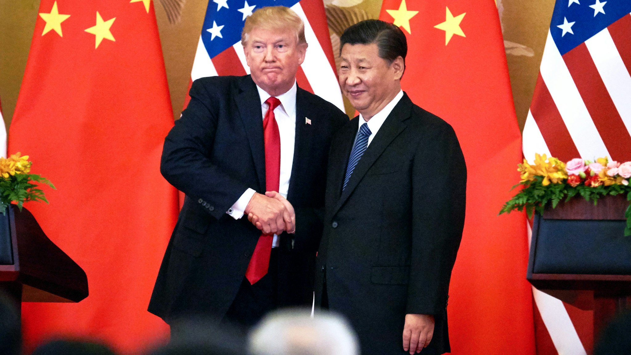 BEIJING, CHINA - NOVEMBER 9, 2017: US President Donald Trump (L) and China's President Xi Jinping shake hands at a press conference following their meeting at the Great Hall of the People in Beijing.