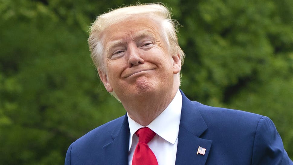 U.S. President Donald Trump and First Lady Melania Trump walk on the South Lawn of the White House after arriving on Marine One in Washington, D.C., U.S., on Monday, May 25, 2020. Trump honored Americas fallen service members on Monday as he commemorated Memorial Day in back-to-back appearances in the midst of the pandemic, according to the AP.
