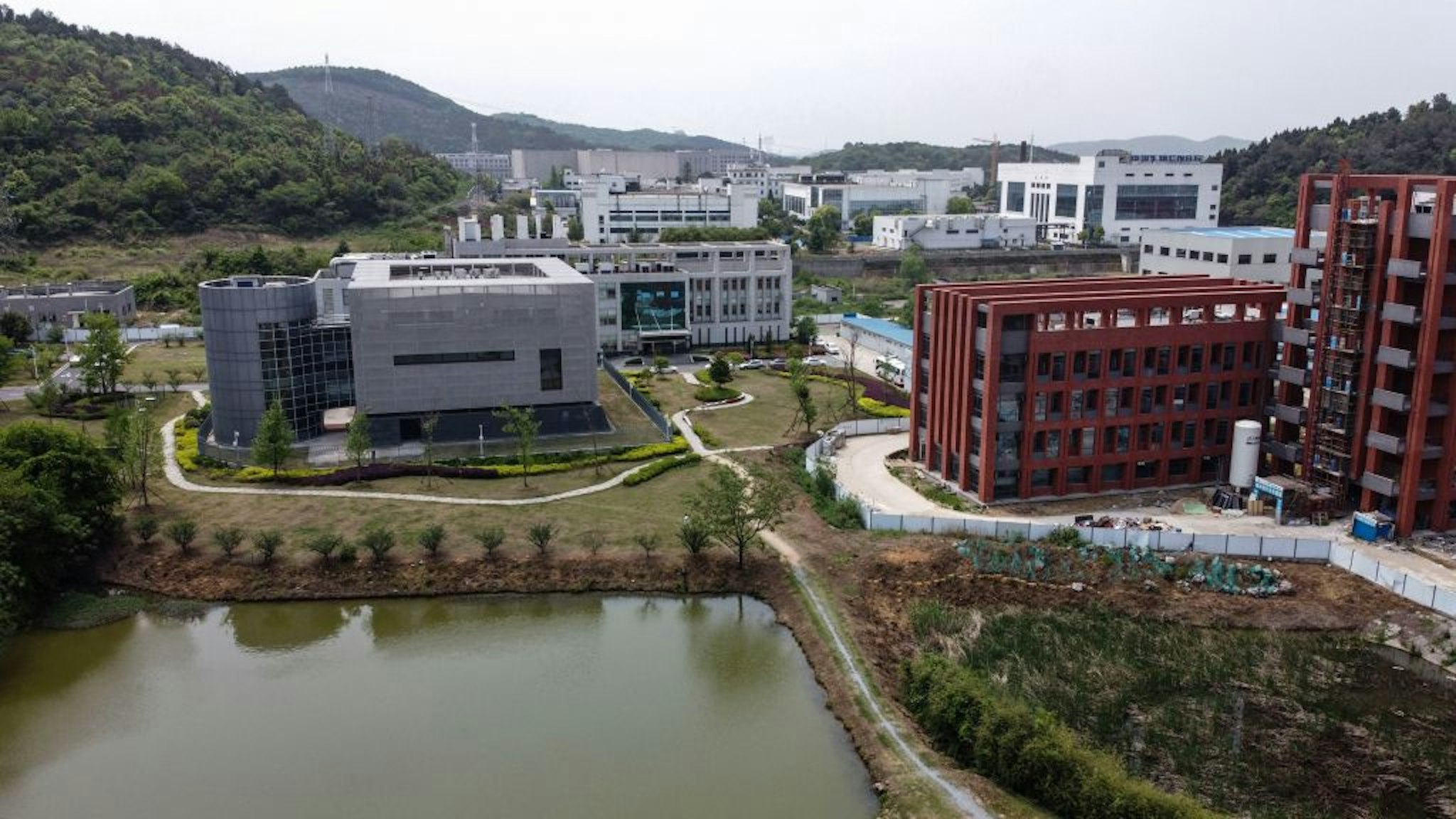 An aerial view shows the P4 laboratory (L) at the Wuhan Institute of Virology in Wuhan in China's central Hubei province on April 17, 2020. - The P4 epidemiological laboratory was built in co-operation with French bio-industrial firm Institut Merieux and the Chinese Academy of Sciences. The facility is among a handful of labs around the world cleared to handle Class 4 pathogens (P4) - dangerous viruses that pose a high risk of person-to-person transmission. (Photo by Hector RETAMAL / AFP) (Photo by HECTOR RETAMAL/AFP via Getty Images)