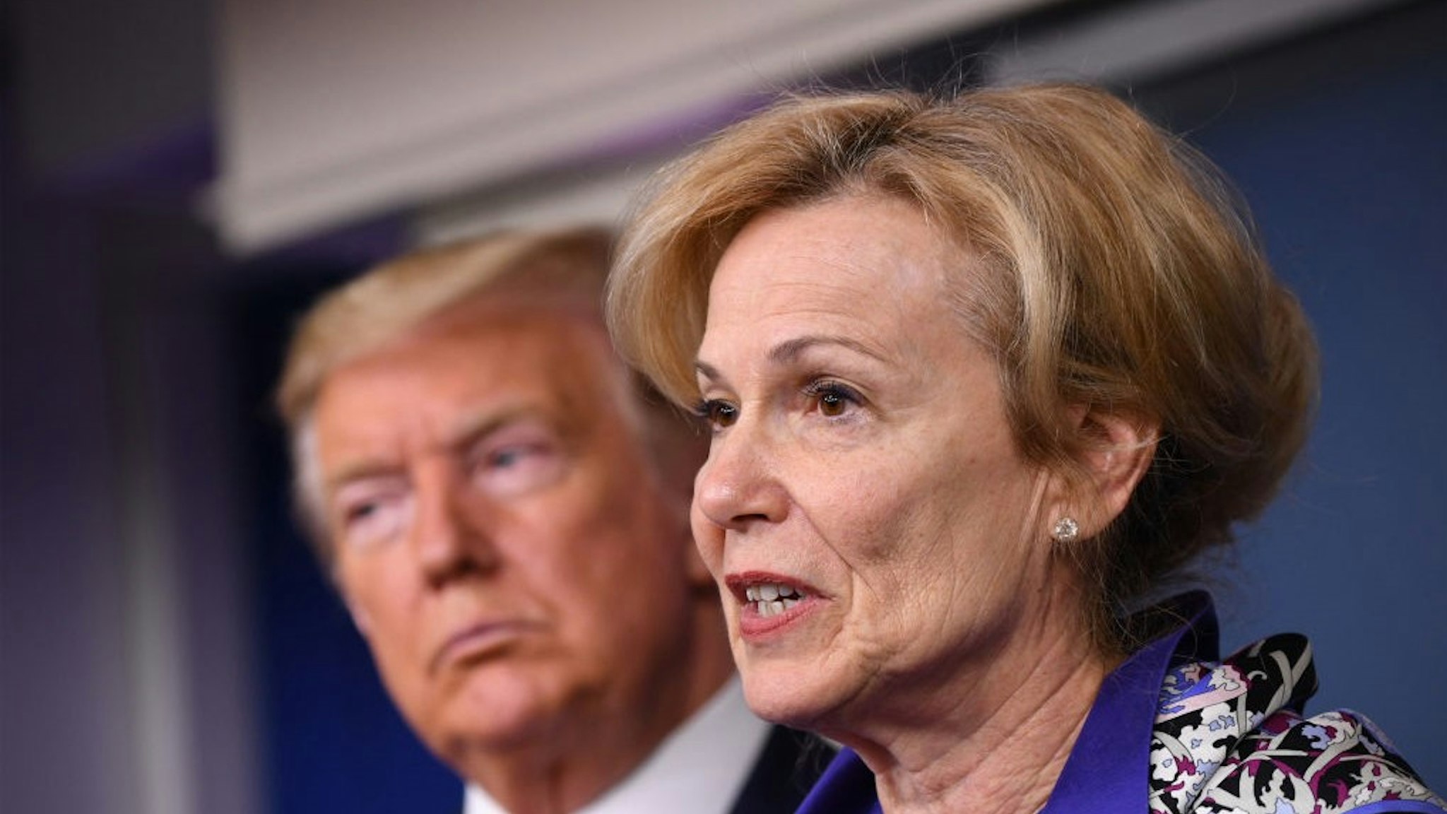 Deborah Birx, coronavirus response coordinator, speaks while U.S. President Donald Trump, left, listens during a Coronavirus Task Force news conference in the briefing room of the White House in Washington, D.C., U.S., on Wednesday, March 18, 2020. Trump invoked the Defense Production Act, allowing the government to boost production of masks and protective equipment. Europe surpassed China in the number of coronavirus infections. Photographer:
