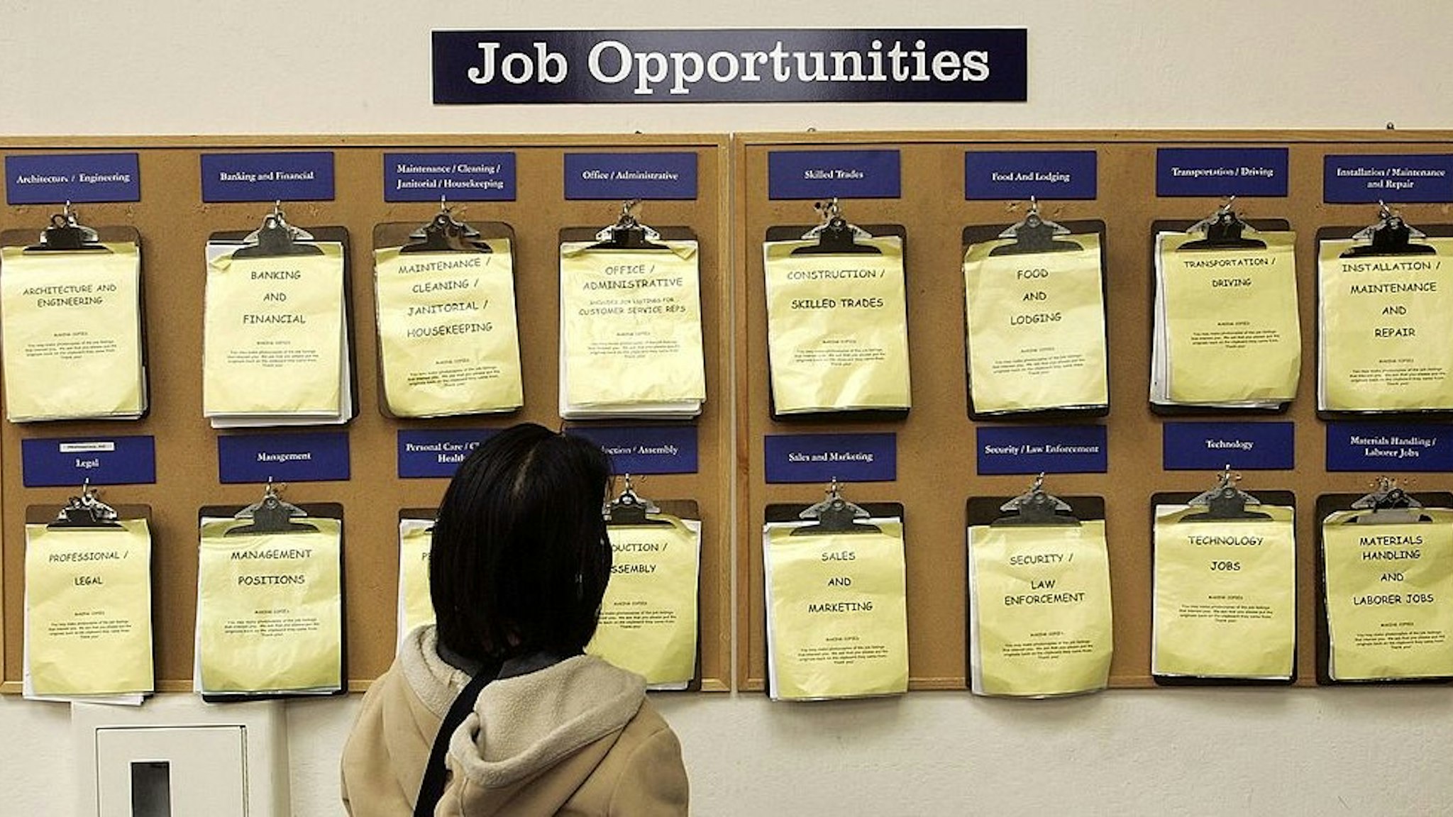 OAKLAND, CA - FEBRUARY 02: A job seeker looks at a job listing board at the East Bay Career Center February 2, 2006 in Oakland, California. According to a government report, U.S. unemployment benefits claims dropped to about 273,000 last week, sending a four-week average of claims to the lowest level in nearly six years. (Photo by
