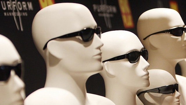 An Indian woman looks at mannequins displaying sunglasses during a press conference in New Delhi on July 2, 2008. New Zealand based Purform, world's largest vendor of plastic mannequins announced a tie-up with India's leading plastic molding company, OK Play India Ltd, to cater to the Indian retail and fashion industry. AFP PHOTO/Manan VATSYAYANA (Photo credit should read