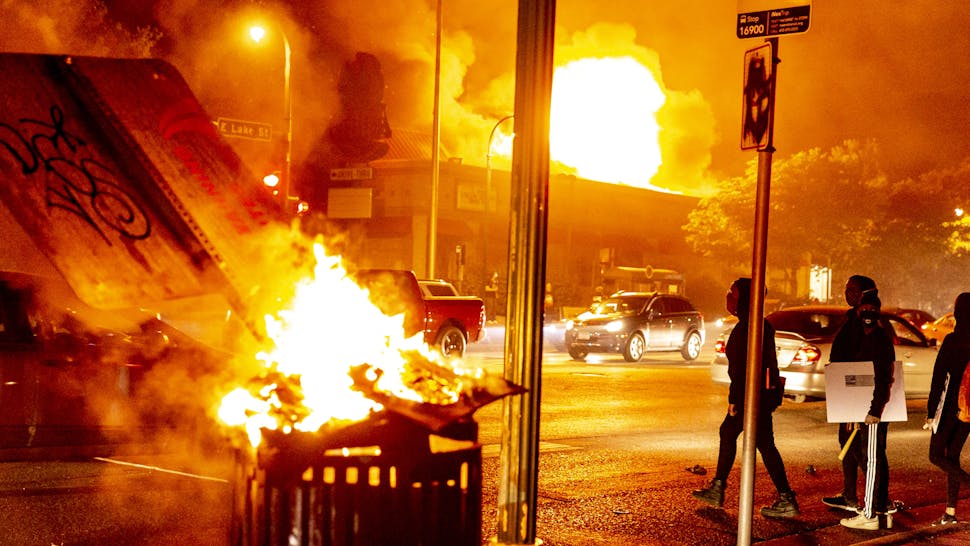 MINNESOTA, USA - MAY 28: Protestors set a shop on fire on Thursday, May 28, 2020, during the third day of protests over the death of George Floyd