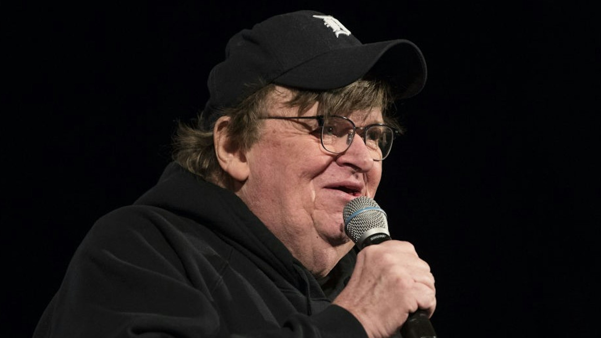 Michael Moore, American filmmaker, speaks during a campaign event for Senator Bernie Sanders, an Independent from Vermont and 2020 presidential candidate, during a town hall event in Rochester, New Hampshire, U.S., on Saturday, Feb. 8, 2020. Sanders is favored to win New Hampshire, but recent polls showed Pete Buttigieg cutting into his lead. Photographer: