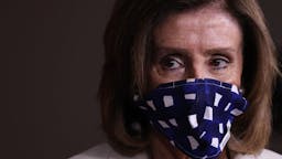 Speaker Pelosi Speaks To The Press In Weekly Briefing WASHINGTON, DC - APRIL 30: Speaker of the House Nancy Pelosi (D-CA) wears a cloth mask to cover her mouth and nose to prevent the spread of the novel coronavirus during her weekly news conference at the U.S. Capitol April 30, 2020 in Washington, DC. While she and Democratic House leaders are not going to reconvene next week due to the COVID-19 pandemic, she said committee chairs are working on the next piece of economic rescue legislation. (Photo b