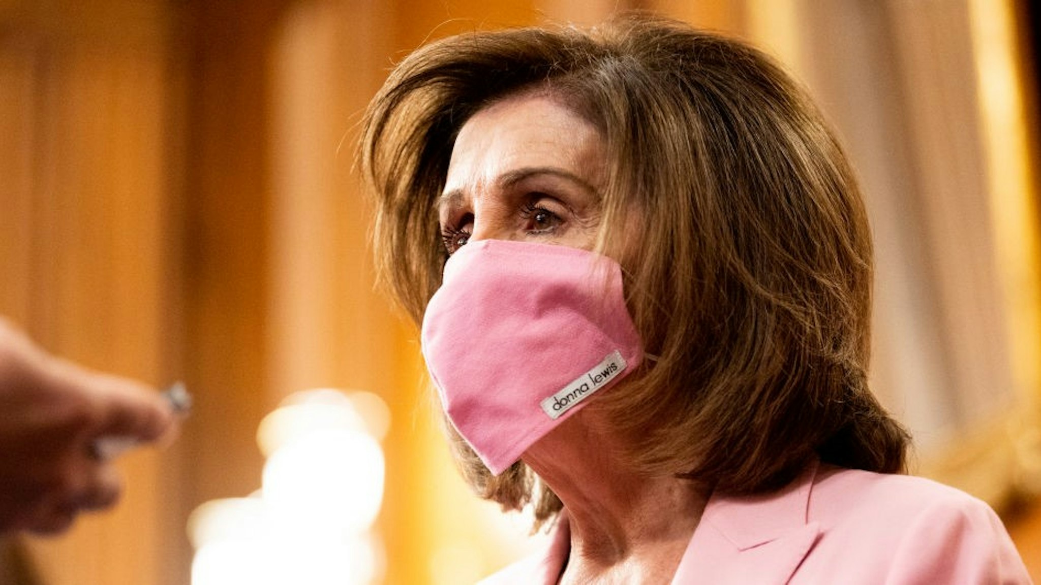 WASHINGTON, UNITED STATES - MAY 05, 2020: U.S. Representative, Nancy Pelosi (D-CA) wearing a face mask as a precaution against the spread of covid 19 virus at the ceremonial swearing in of Representative Elect Kweisi Mfume (D-MD).- PHOTOGRAPH BY Michael Brochstein / Echoes Wire/ Barcroft Studios / Future Publishing (Photo credit should read