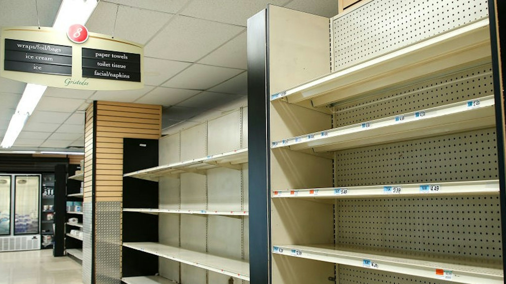 NEW YORK, UNITED STATES - MARCH 21, 2020: Empty store shelves are seen in a supermarket as people has been stocking up for food and other essential items fearing the supply shortages. As the coronavirus (COVID-19) continues to spread throughout the United States, New Yorkers continue with daily routines limited to shopping and other essential tasks. On March 21, 2020 Governor Andrew Cuomo of New York announced that New York City has become the epicenter of the coronavirus surpassing 10,000 cases.- PHOTOGRAPH BY John Lamparski / Echoes Wire/ Barcroft Studios / Future Publishing (Photo credit should read