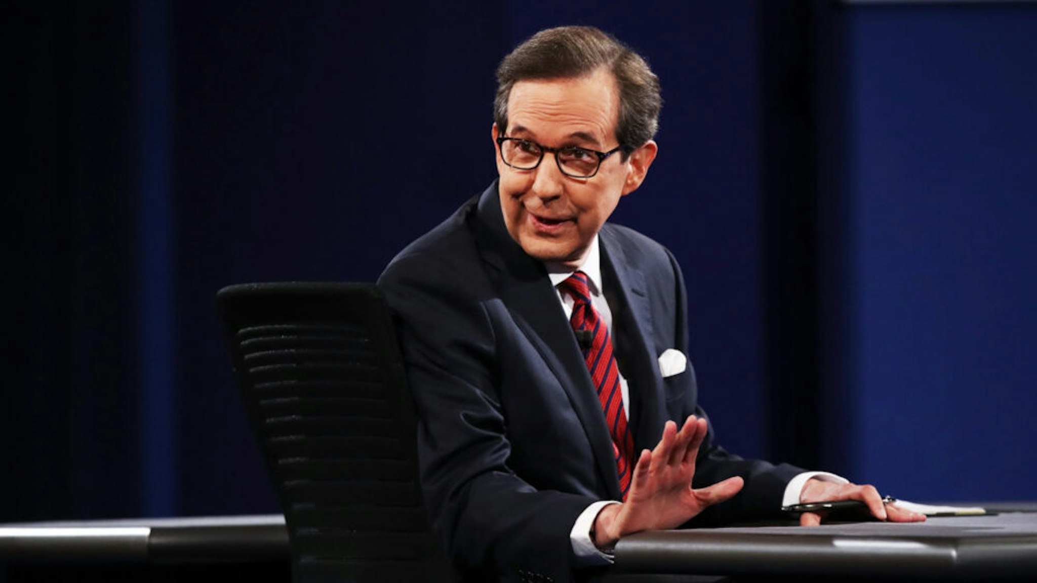Fox News anchor and moderator Chris Wallace speaks to the guests and attendees during the third U.S. presidential debate at the Thomas & Mack Center on October 19, 2016 in Las Vegas, Nevada.