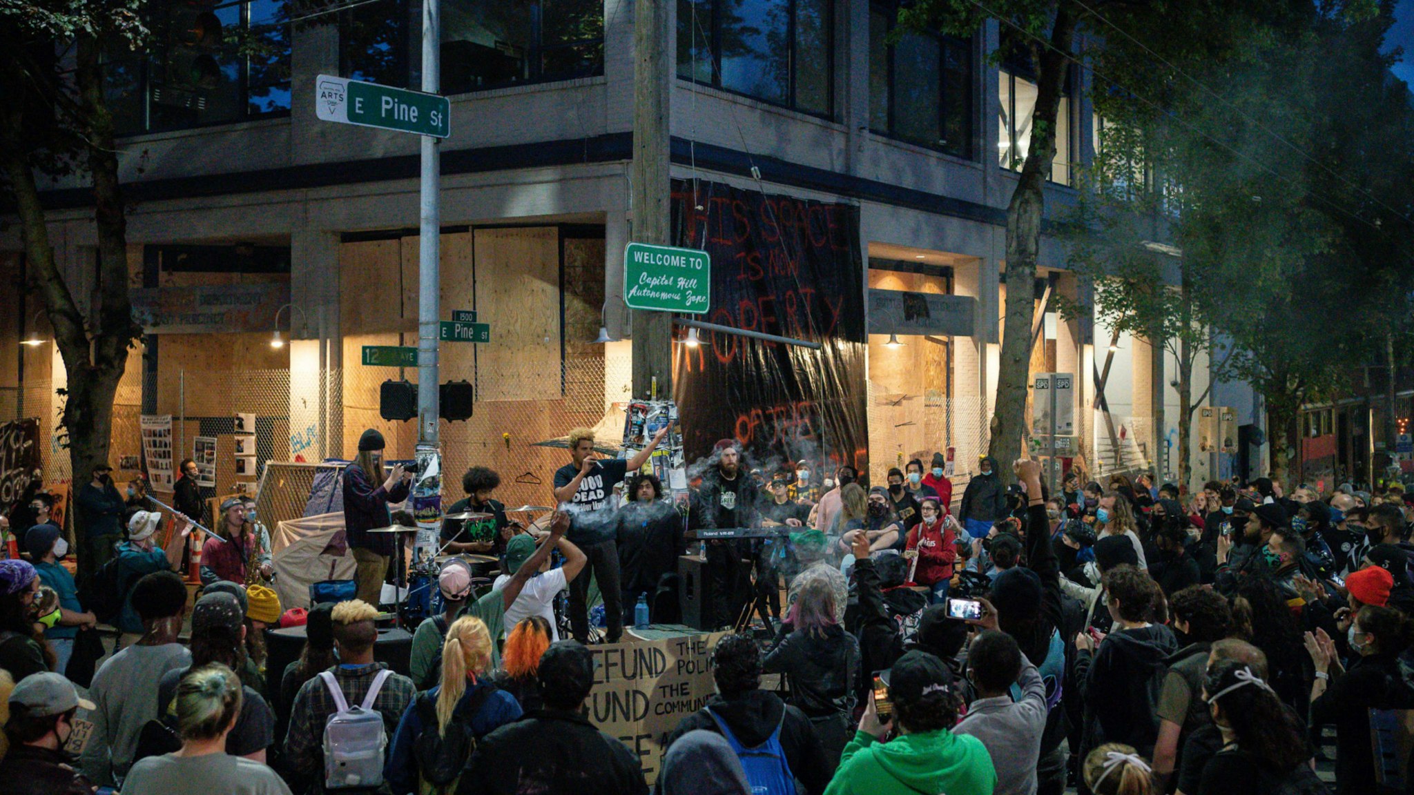 A band plays a free show in front of the Seattle Police Departments East Precinct in the so-called "Capitol Hill Autonomous Zone" on June 10, 2020 in Seattle, Washington.