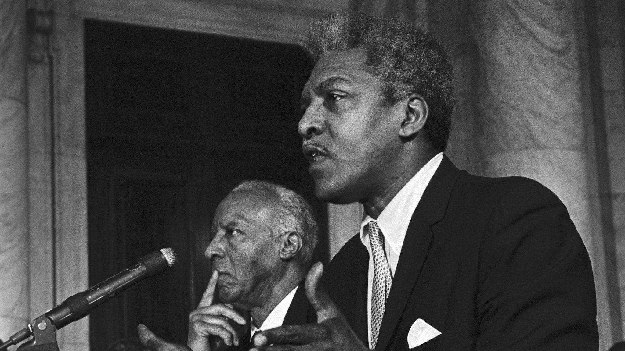 Bayard Rustin, Executive Director of the A. Phillip Randolph Institute, urged action on the "freedom budget' developed by the Institute which would guarantee an Annual wage for poor people.