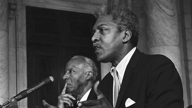 Bayard Rustin, Executive Director of the A. Phillip Randolph Institute, urged action on the "freedom budget' developed by the Institute which would guarantee an Annual wage for poor people.