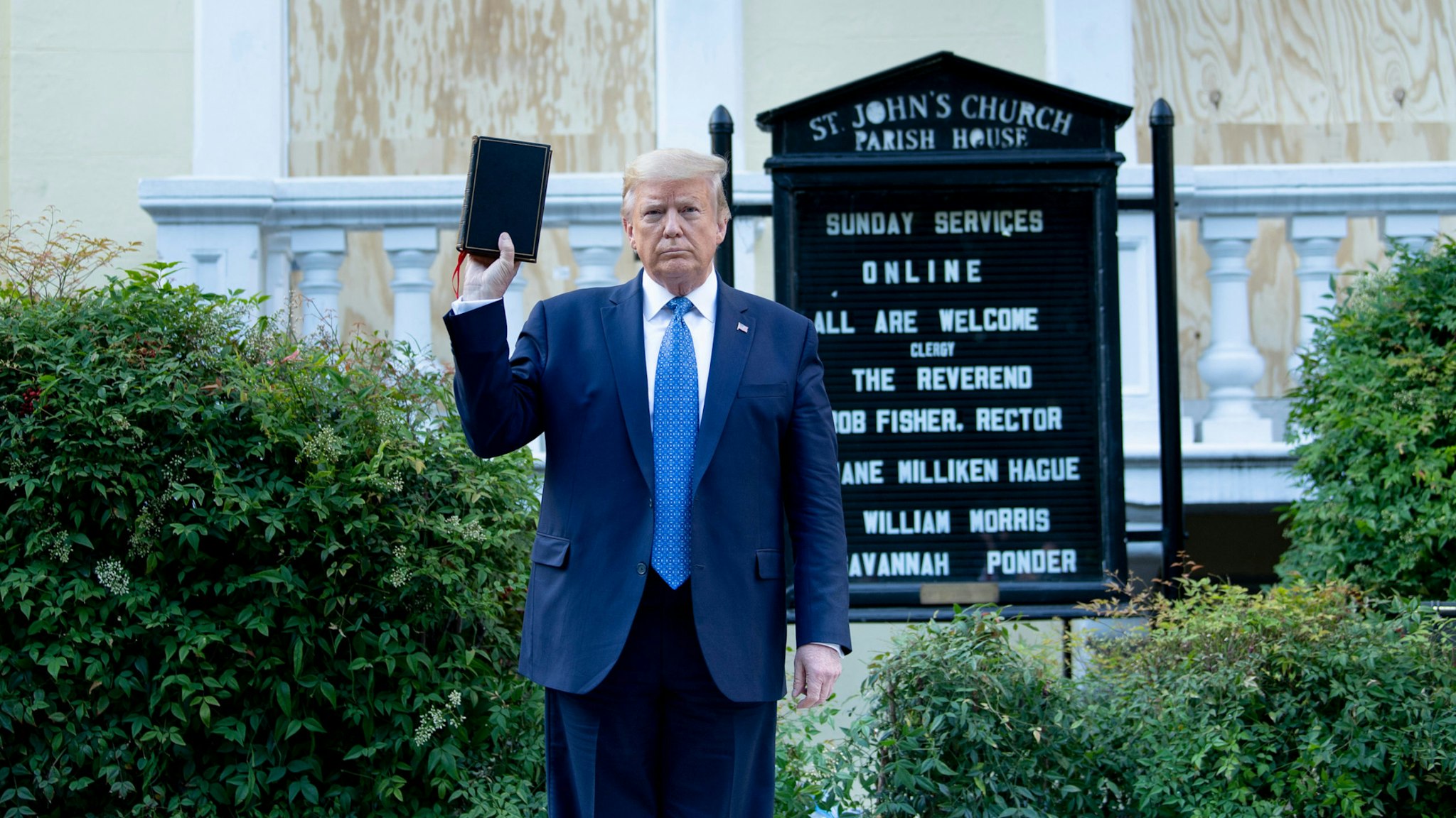 US President Donald Trump holds a Bible while visiting St. John's Church across from the White House after the area was cleared of people protesting the death of George Floyd June 1, 2020, in Washington, DC.