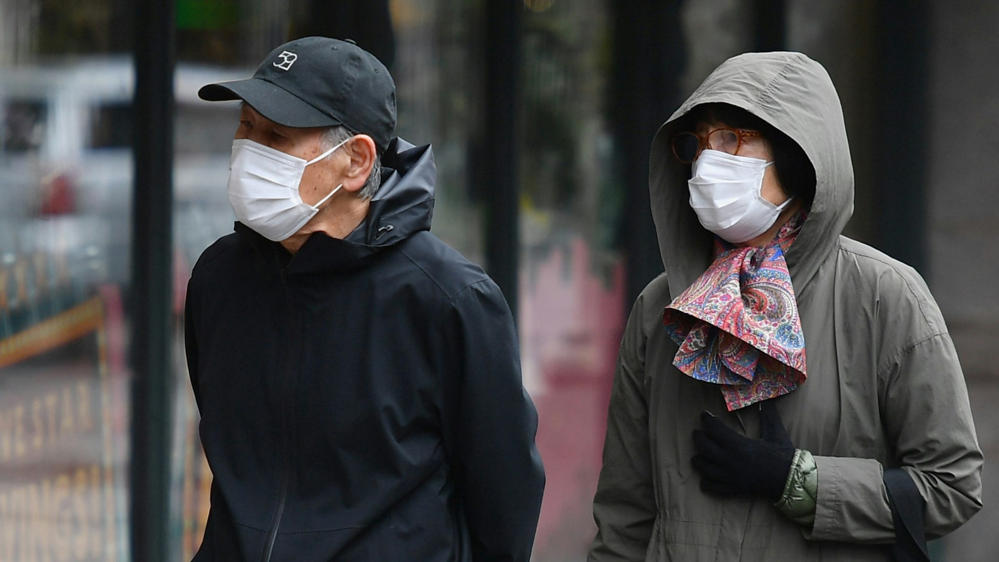 People wear face masks on April 03, 2020 in New York.