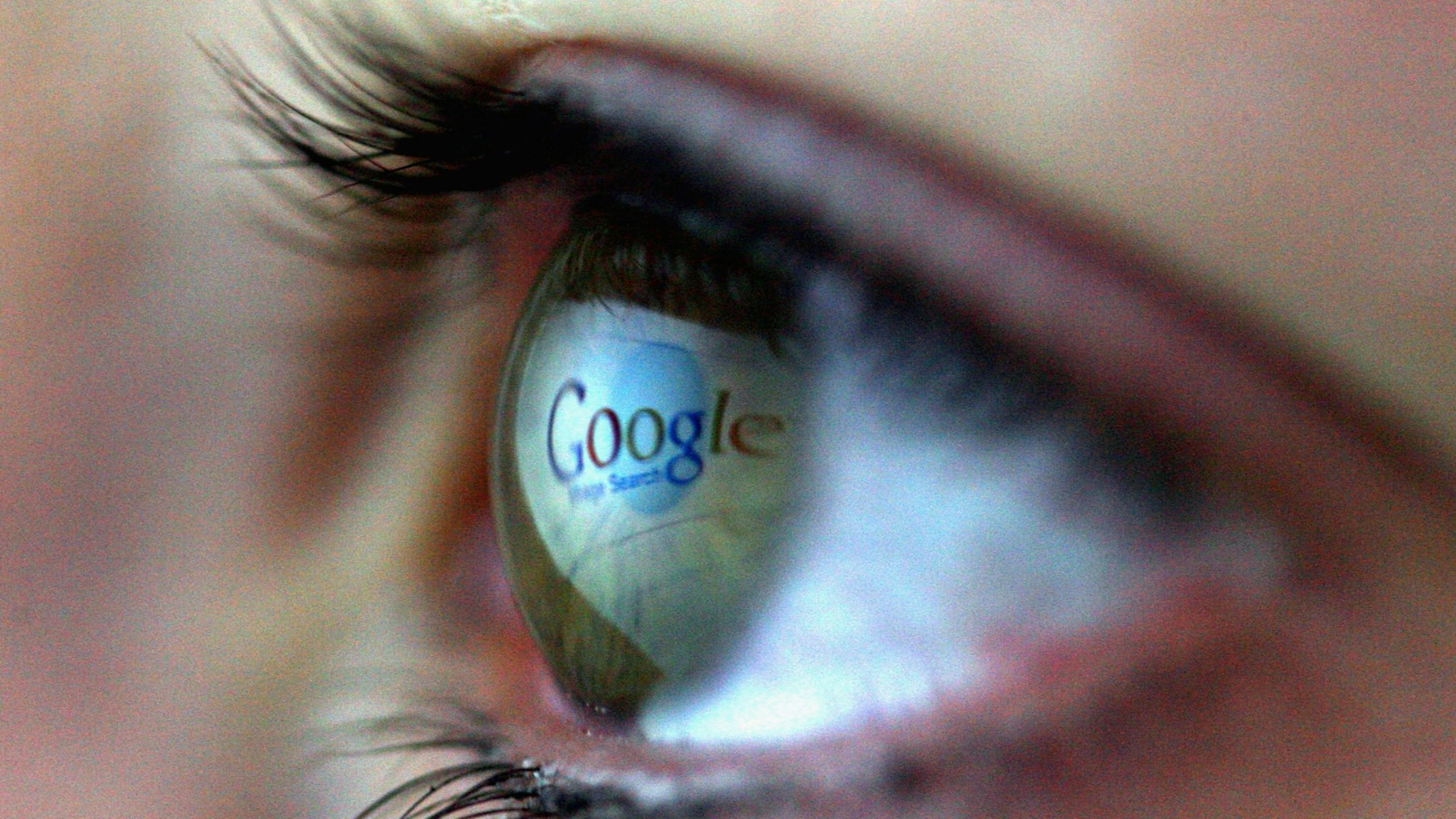 In this photo illustration the Google logo is reflected in the eye of a girl on February 3, 2008 in London, England.