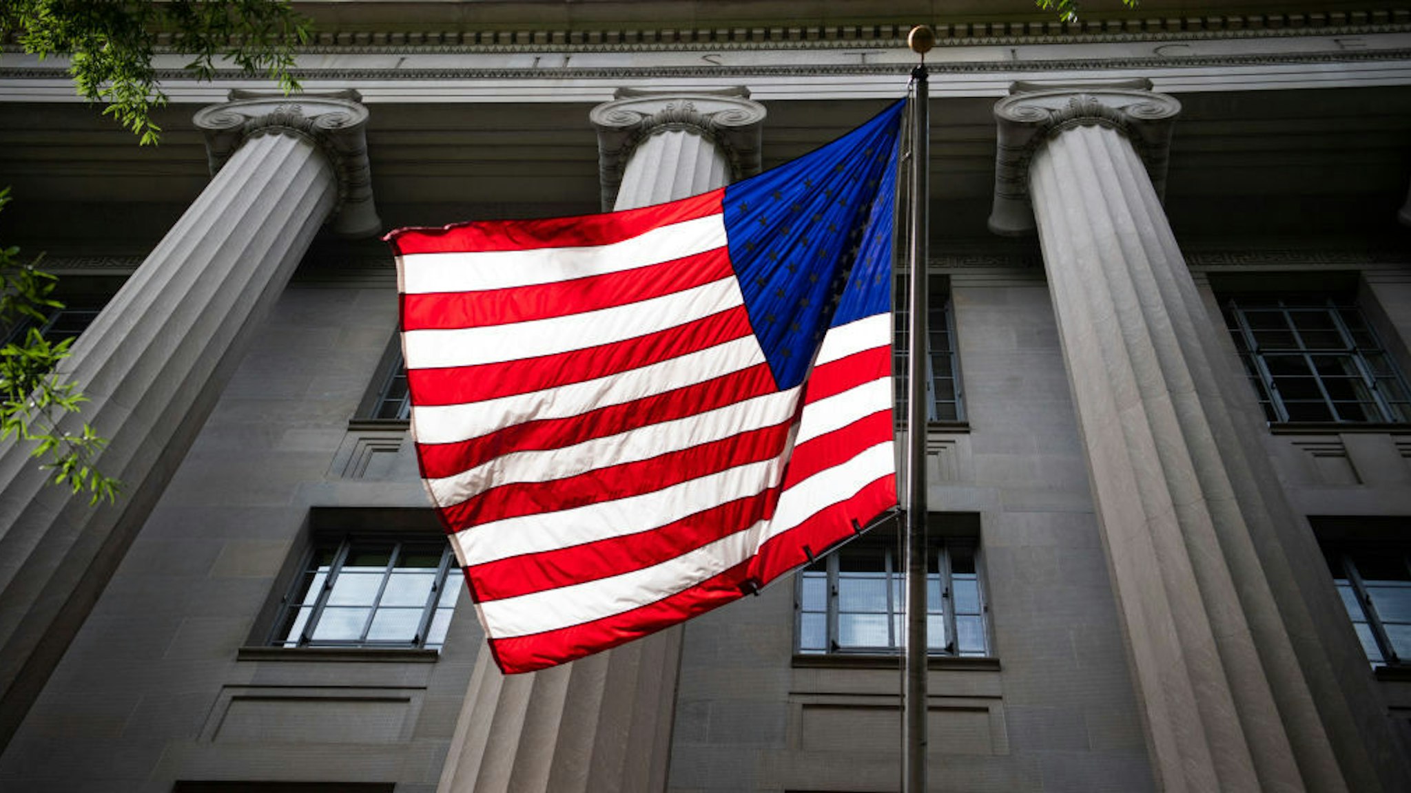 An American flag is displayed on the Pennsylvania Avenue side of the Department of Justice on Wednesday, June 3, 2020.(Photo By Tom Williams/CQ-Roll Call, Inc via Getty Images)