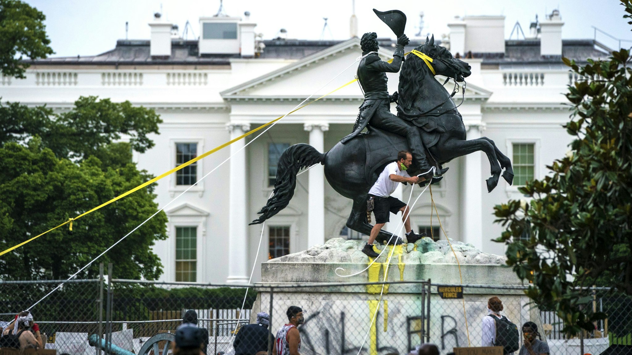 WASHINGTON, DC - JUNE 22: Protesters attempt to pull down the statue of Andrew Jackson in Lafayette Square near the White House on June 22, 2020 in Washington, DC. Protests continue around the country over police brutality, racial injustice and the deaths of African Americans while in police custody.