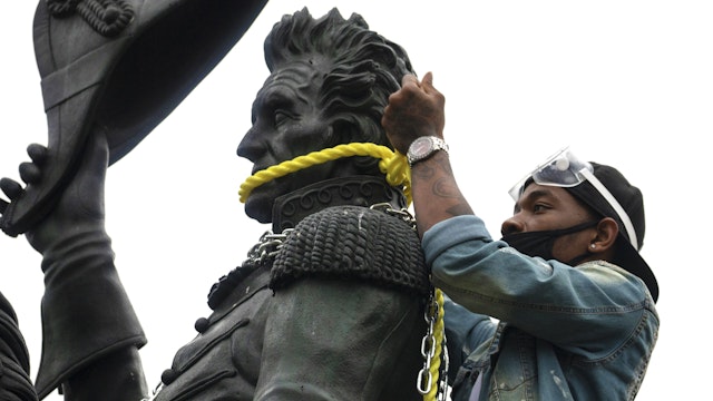 WASHINGTON, DC - JUNE 22: Protesters attempt to pull down the statue of Andrew Jackson in Lafayette Square near the White House on June 22, 2020 in Washington, DC. Protests continue around the country over the deaths of African Americans while in police custody.