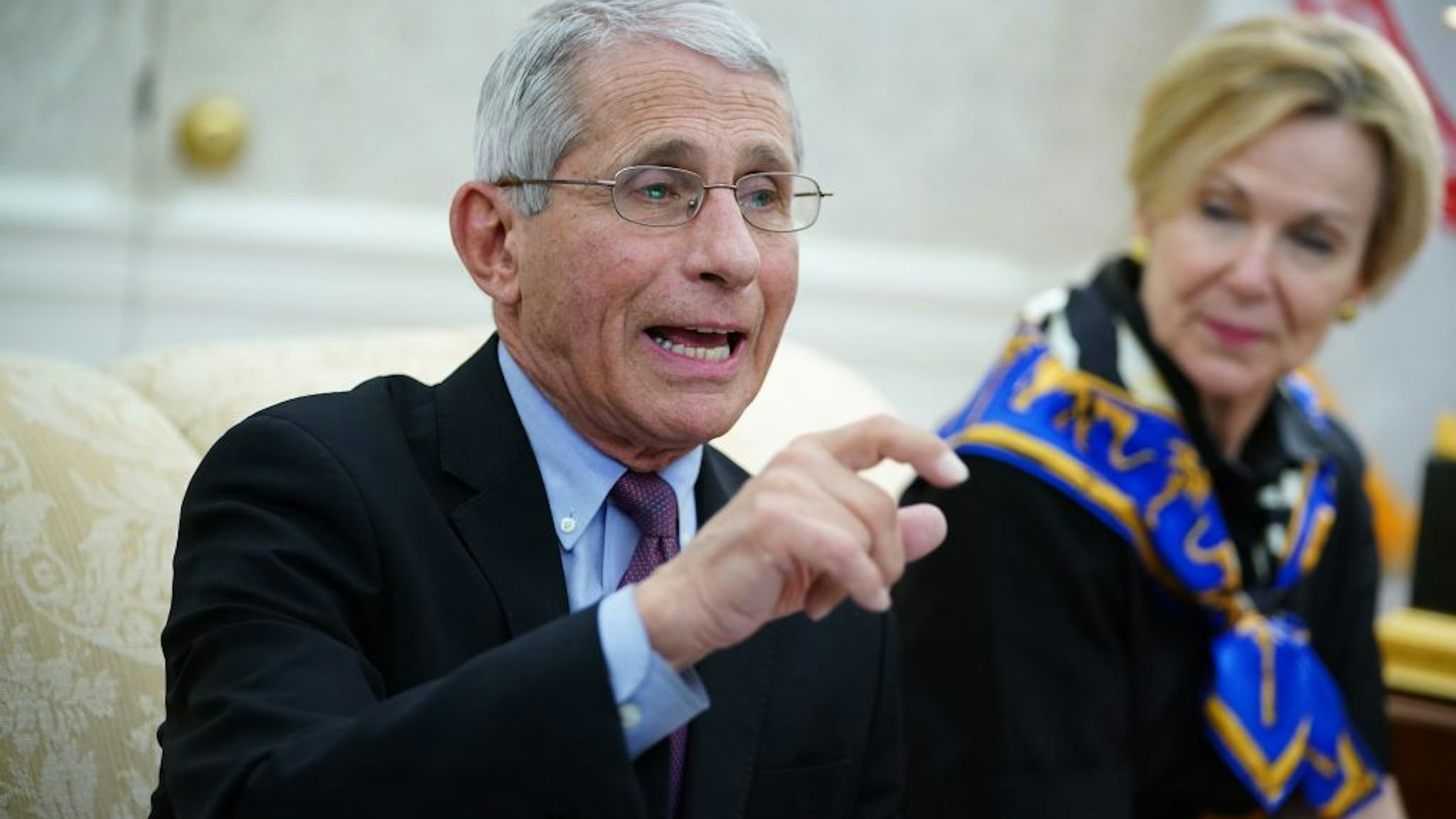 Dr. Anthony Fauci (L), director of the National Institute of Allergy and Infectious Diseases speaks next to Response coordinator for White House Coronavirus Task Force Deborah Birx, during a meeting with US President Donald Trump and Louisiana Governor John Bel Edwards D-LA in the Oval Office of the White House in Washington, DC on April 29, 2020. (Photo by MANDEL NGAN / AFP) (Photo by MANDEL NGAN/AFP via Getty Images)