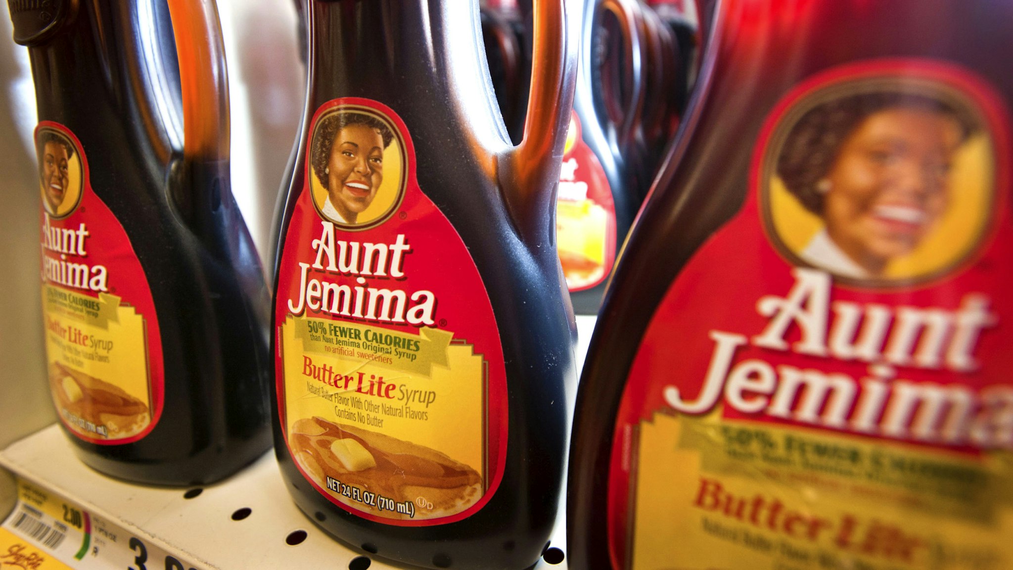 Bottles of PepsiCo Inc. Aunt Jemima syrup are displayed for sale at a ShopRite Holdings Ltd. grocery store in Stratford, Connecticut, U.S., on Wednesday, Aug. 3, 2011. PepsiCo Inc. reported growth for the second quarter of 2011 partly due to the acquisition of Wimm-Bill-Dann, the leading dairy and juice company in Russia.