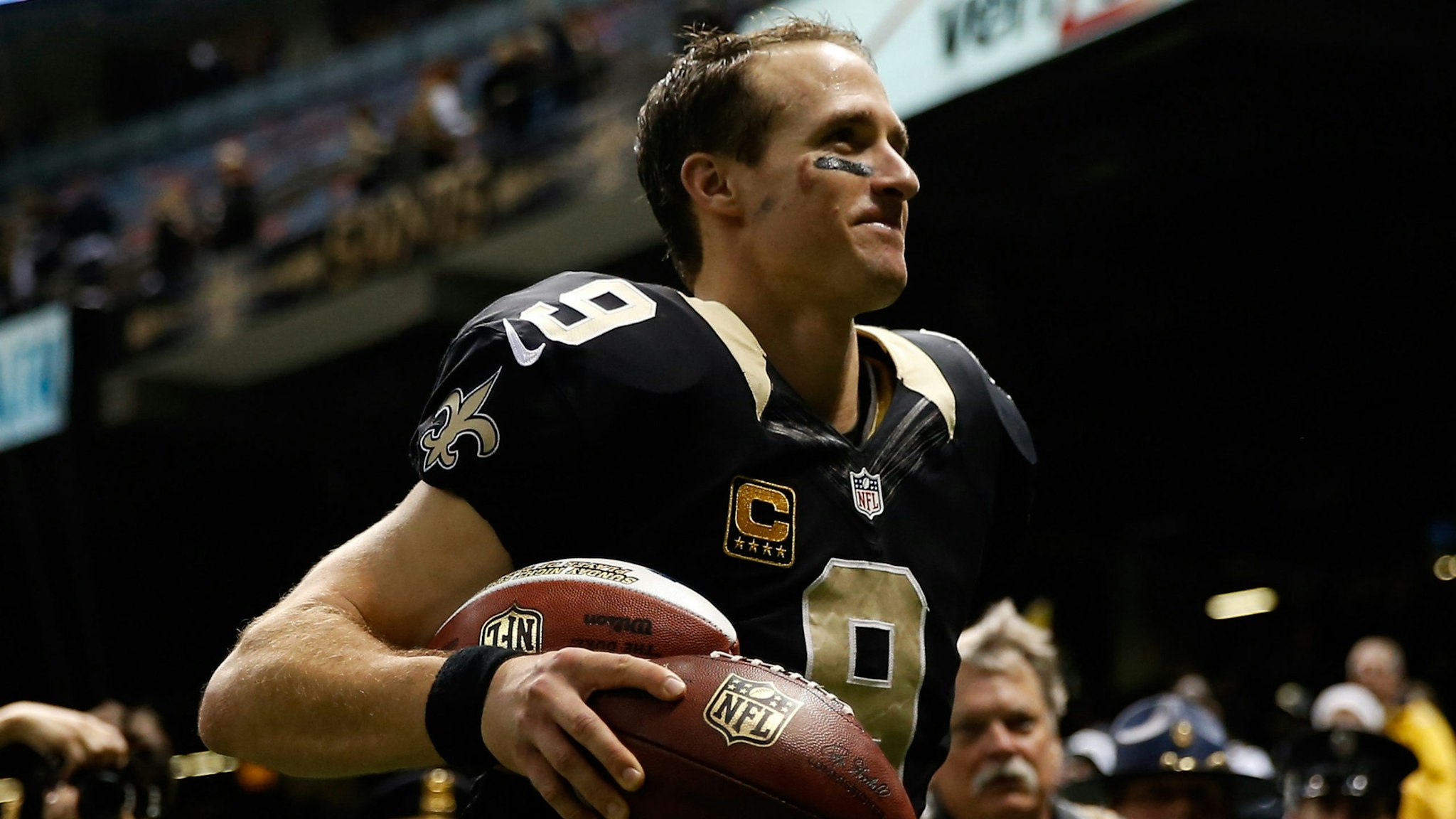 Drew Brees #9 of the New Orleans Saints celebrates after defeating the Carolina Panthers at Mercedes-Benz Superdome on December 8, 2013 in New Orleans, Louisiana.