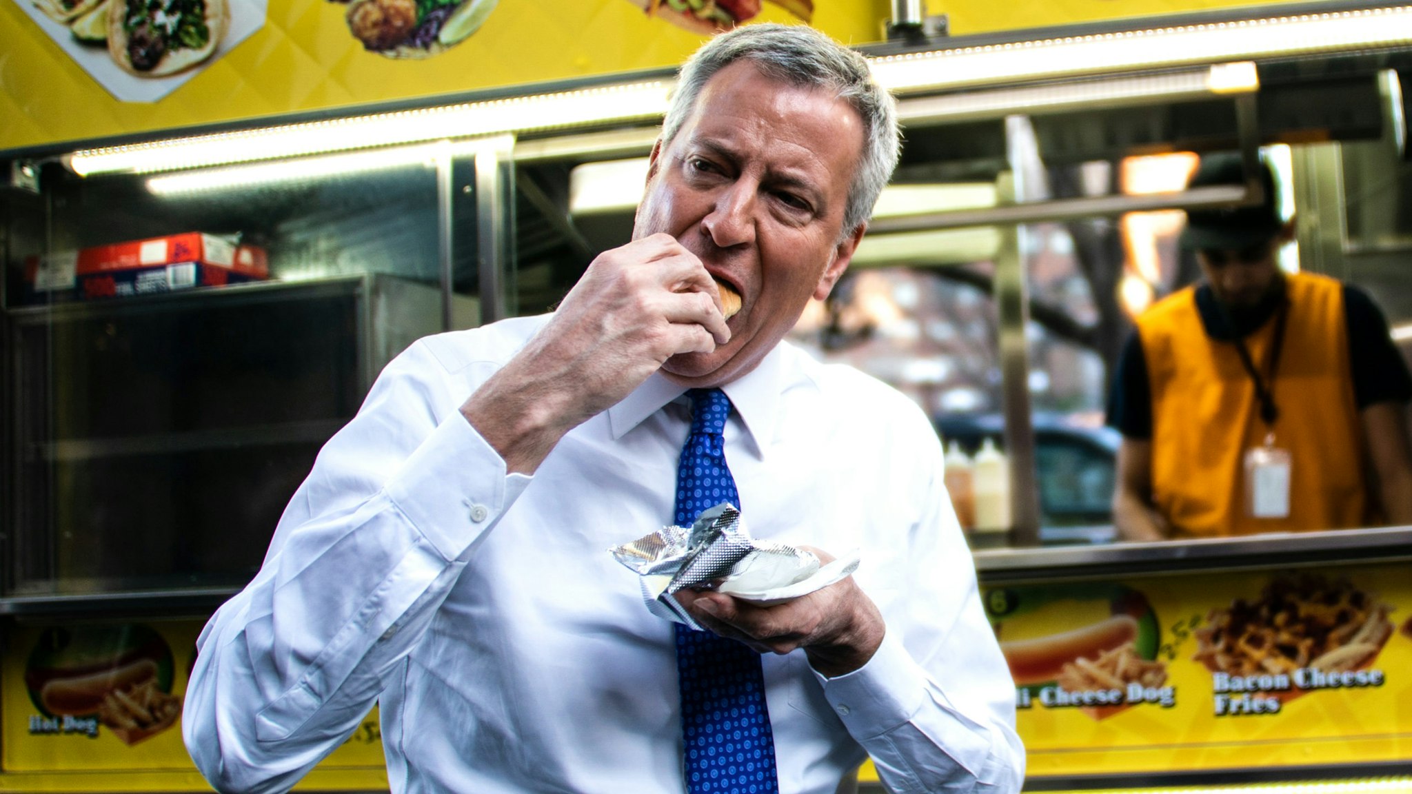 NEW YORK, NY - MARCH 09: New York Mayor Bill De Blasio eats a hot dog in Union Square to distribute information about the Coronavirus on March 9, 2020 in New York City. There are now 20 confirmed coronavirus cases in the city including a 7-year-old girl in the Bronx.