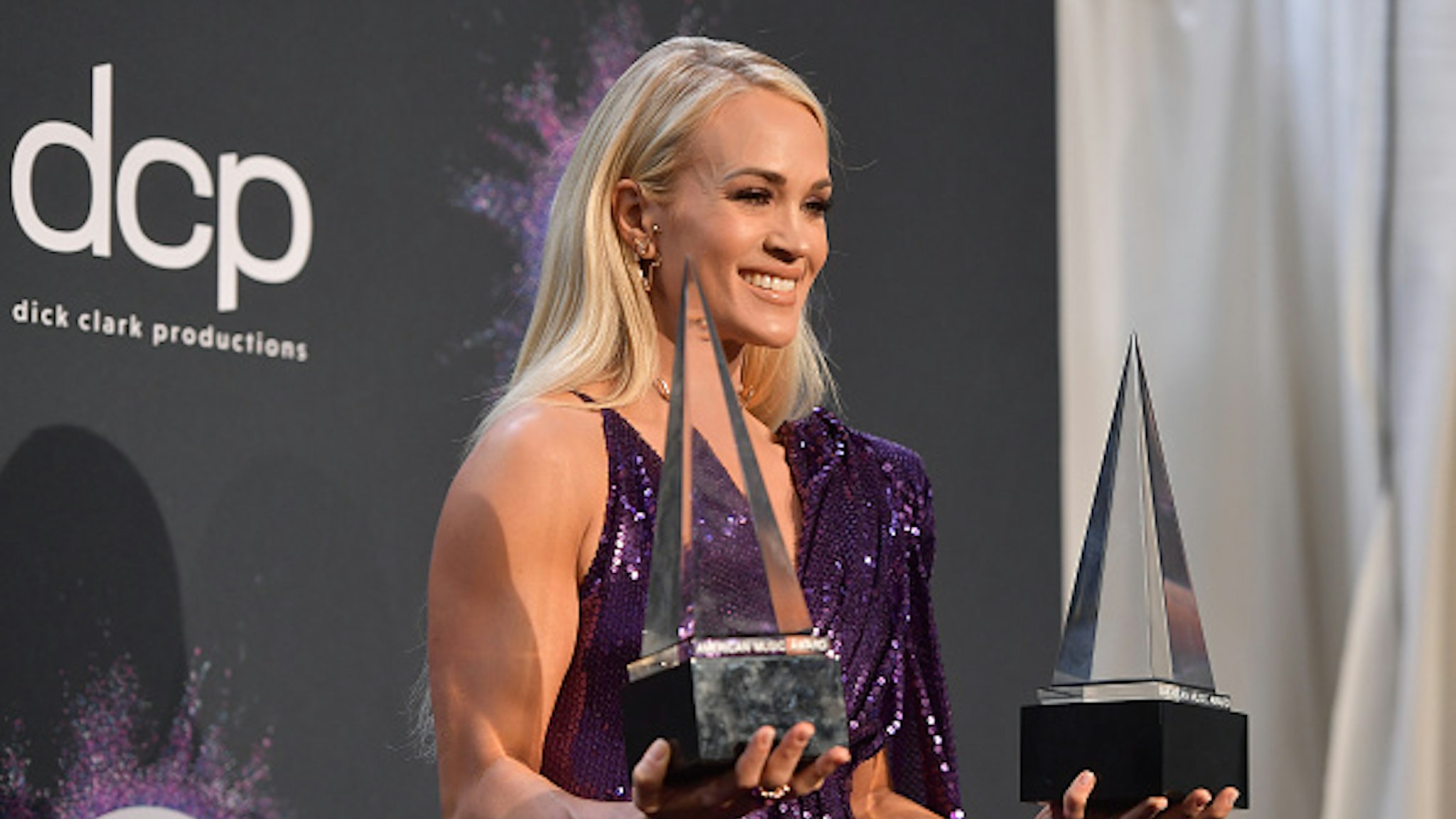 LOS ANGELES, CALIFORNIA - NOVEMBER 24: Carrie Underwood, winner of the Favorite Album - Country award for 'Cry Pretty' and Favorite Female Artist - Country award, poses in the press room during the 2019 American Music Awards at Microsoft Theater on November 24, 2019 in Los Angeles, California