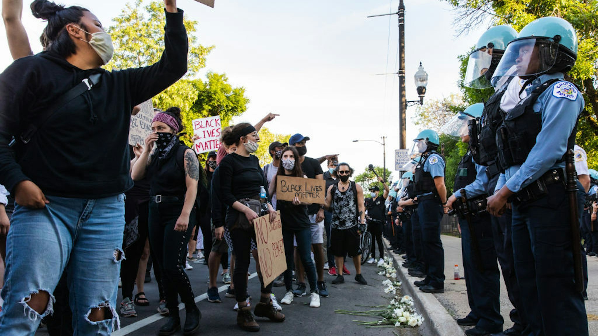 Protesters chant and wave signs at the CPD during a protest on June 06, 2020 in Chicago, Illinois. This is the 12th day of protests since George Floyd died in Minneapolis police custody on May 25. (Photo by Natasha Moustache/Getty Images)