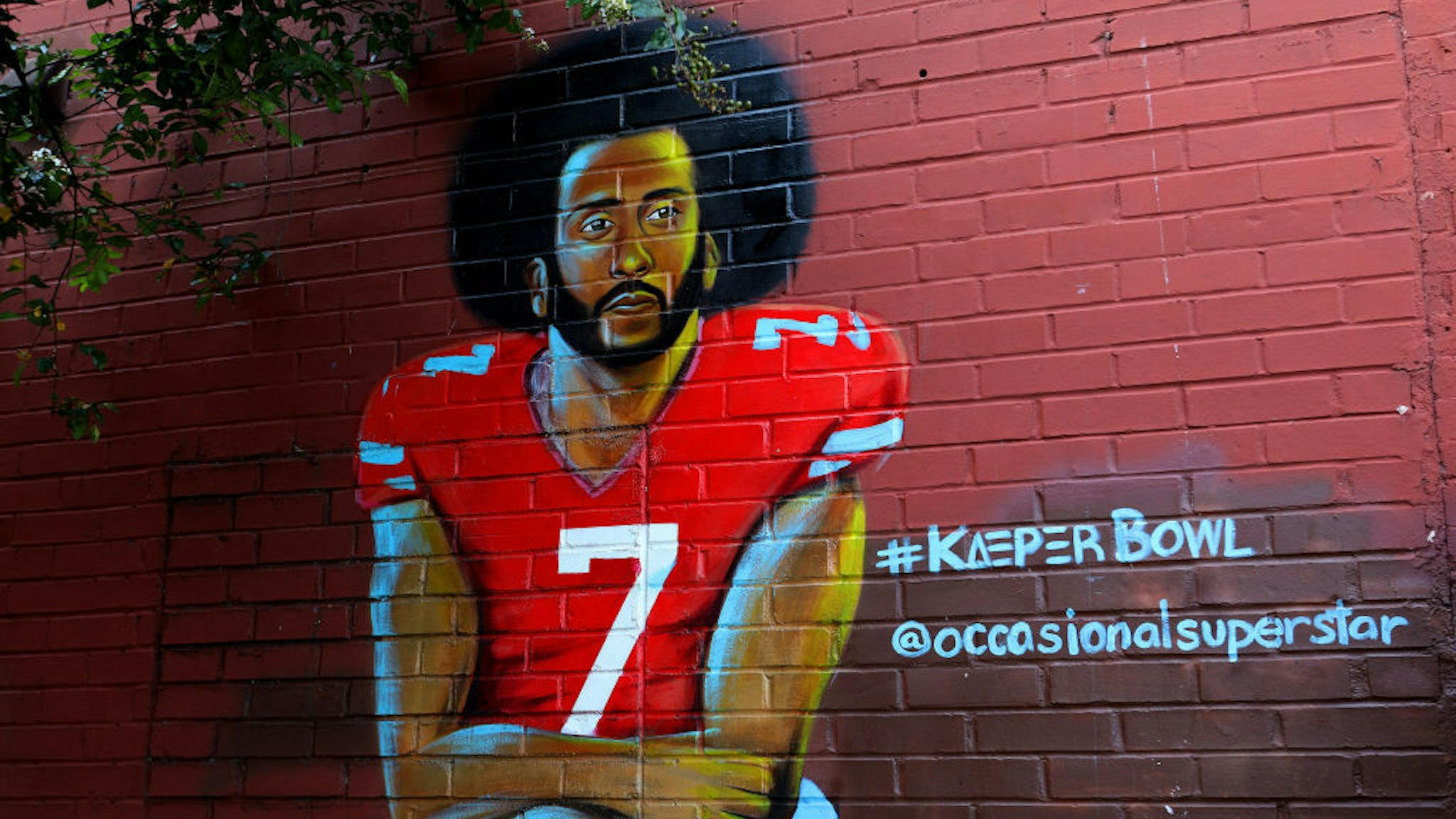 Muhammad Yungai's 'Colin Kaepernick' mural is displayed in the Old Fourth Ward neighborhood in Atlanta, Georgia on July 27, 2019. (Photo By Raymond Boyd/Getty Images)