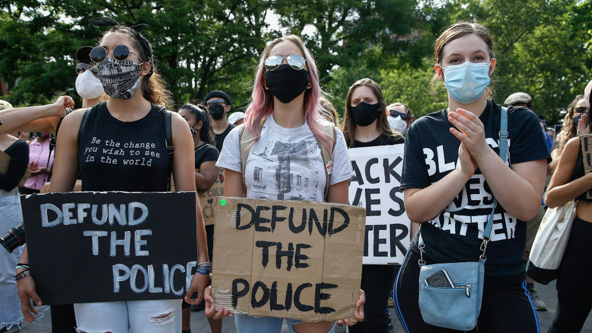 Demonstrators hold placards saying 'Defund The Police' during the protest. Protests continue against police brutality and racial injustice in New York City. (Photo by John Lamparski/SOPA Images/LightRocket via Getty Images)