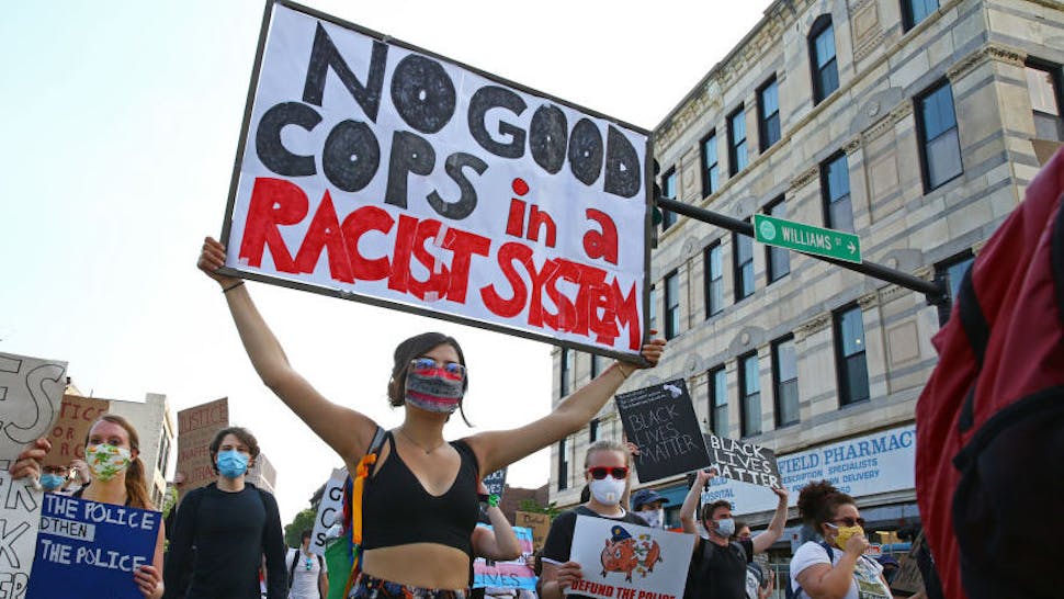 Defund the Police The group heads out of Nubian Square toward City Hall during the march on June 10, 2020 in Boston. The FTP (For The People) youth protesters gather in Nubian Square for a speaking program and then march to City Hall. They call for defunding the police and to remove police from schools. There have been several protests since the killing of George Floyd by the Minneapolis police. (Photo by Pat Greenhouse/The Boston Globe via Getty Images)