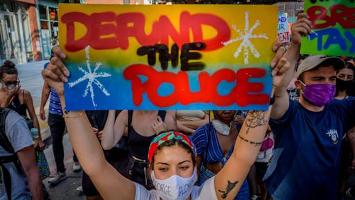 Black Lives Matter De-fund the Police Rally in New York A participant holding a Defund The Police sign at the protest. Hundreds of Brooklynites joined Democratic candidate for U.S. House New York District 7, Paperboy Love Prince for a massive march from BedStuy to Bushwick demanding justice for all victims of police brutality, making a loud call to defund the NYPD and invest in communities. (Photo by Erik McGregor/LightRocket via Getty Images)
