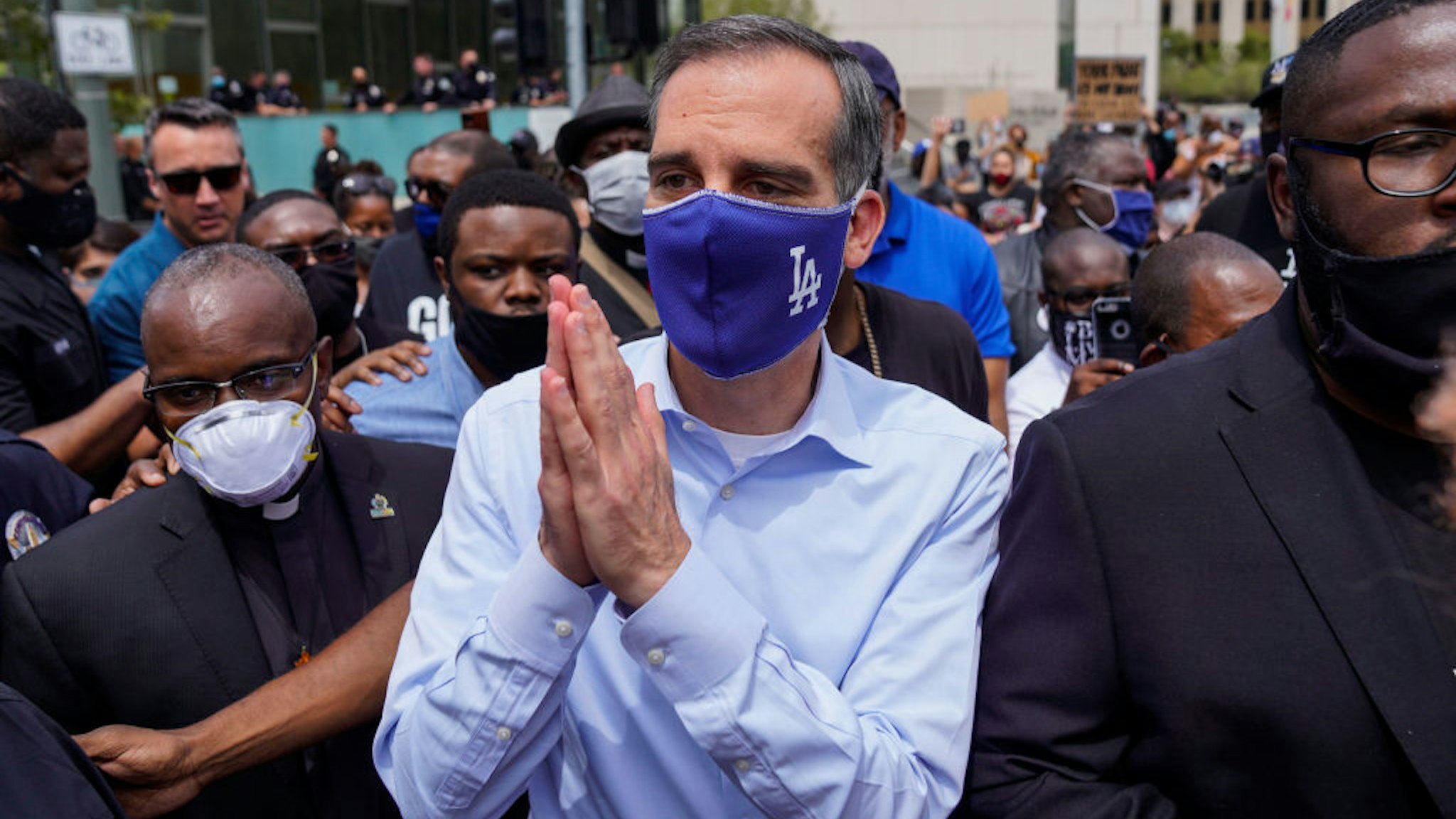 LOS ANGELES, CA - JUNE 02: LA Mayor Eric Garcetti walks out to address protesters and clergy members from the Los Angeles area that are participating in a march and peaceful protest in downtown Los Angeles outside of LA City Hall and LAPD Headquarters on Tuesday, June 2, 2020 in Los Angeles, CA. Protests erupted across the country, with people outraged over the death of George Floyd, a black man killed after a white Minneapolis police officer pinned him to the ground with his knee. (Kent Nishimura / Los Angeles Times via Getty Images)