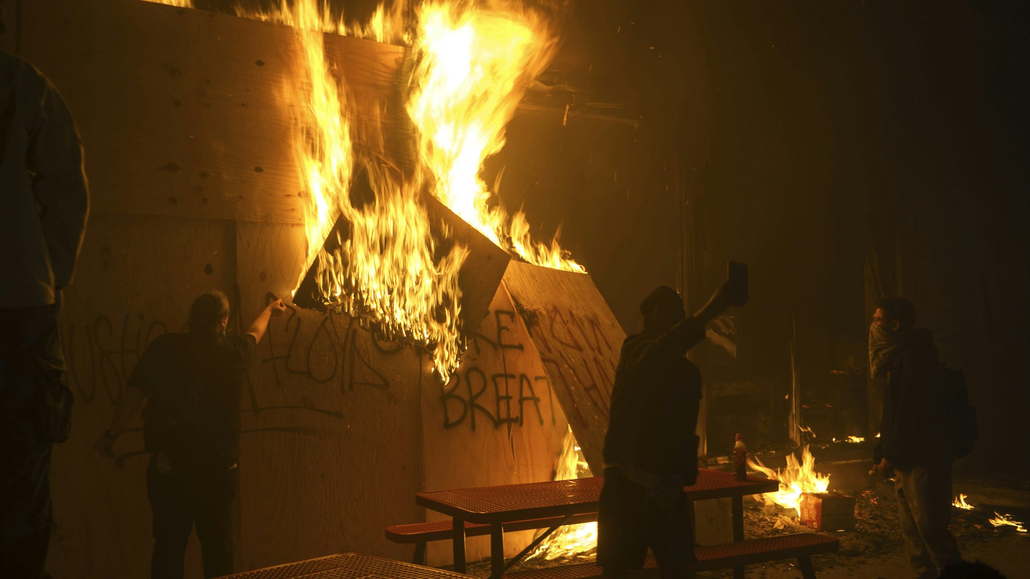 Building burns in Minneapolis, United States, on May 30, 2020 during a demonstration to call for justice for George Floyd, a black man who died while in custody of the Minneapolis police. Curfews were imposed in major US cities Saturday as clashes over police brutality escalated across America.