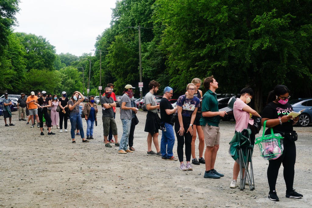 ATLANTA, GA - JUNE 09: People wait in line to vote in Georgia's Primary Election on June 9, 2020 in Atlanta, Georgia. Georgia, West Virginia, South Carolina, North Dakota, and Nevada are holding primaries amid the coronavirus pandemic. (Photo by Elijah Nouvelage/Getty Images)