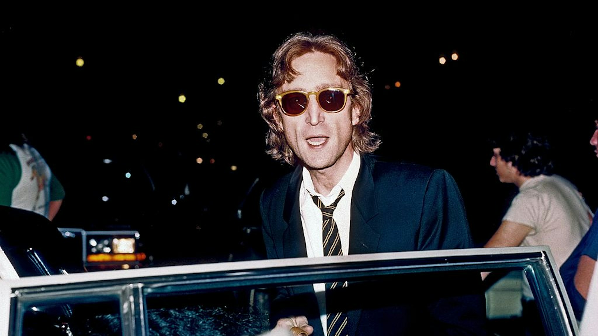 Former Beatle John Lennon arrives at the Times Square recording studio 'The Hit Factory' before a recording session of his final album 'Double Fanasy' in August 1980 in New York City, New York.