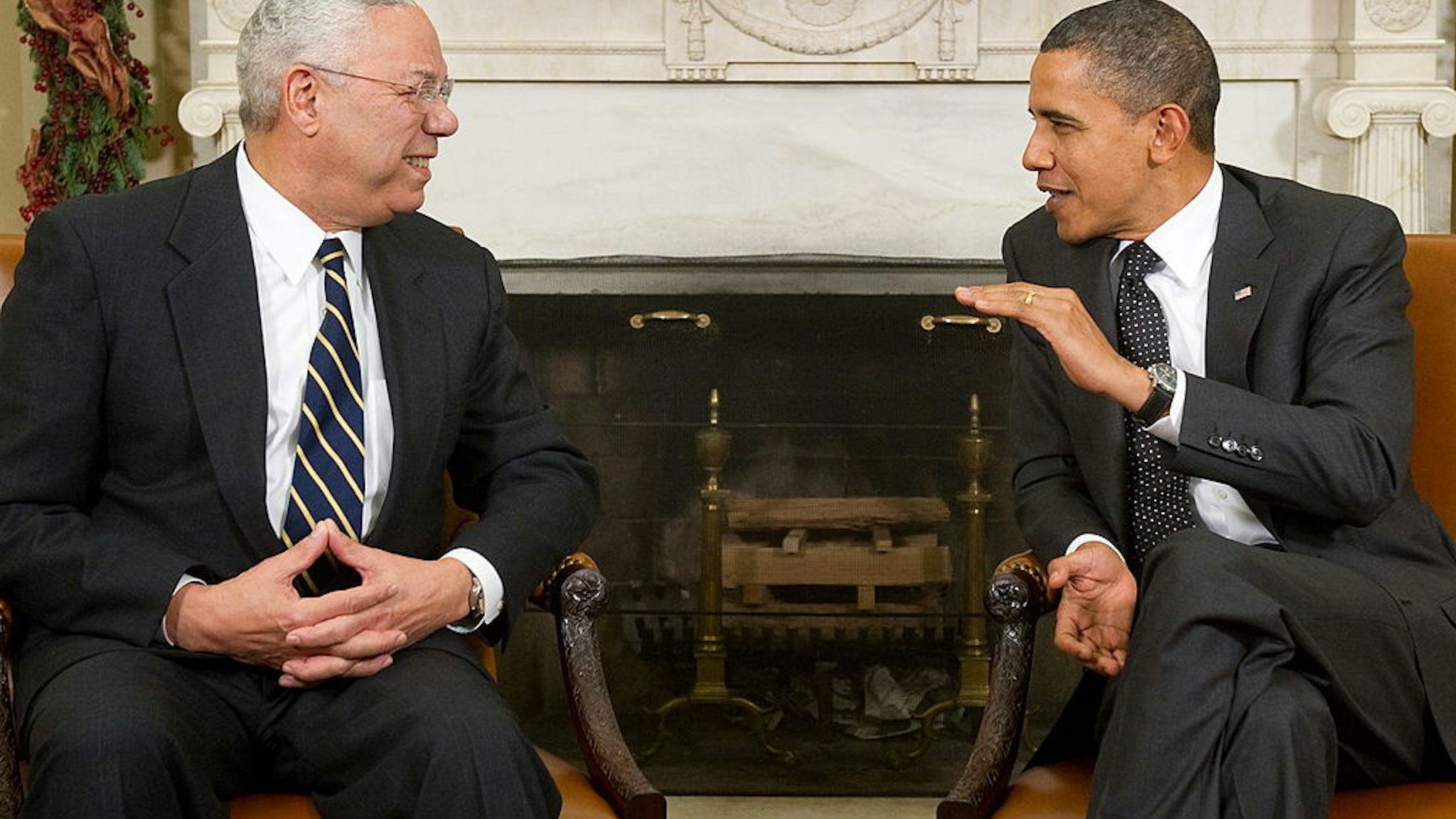 US President Barack Obama speaks with former US Secretary of State General Colin Powell (L) during a meeting in the Oval Office of the White House in Washington, DC, December 1, 2010