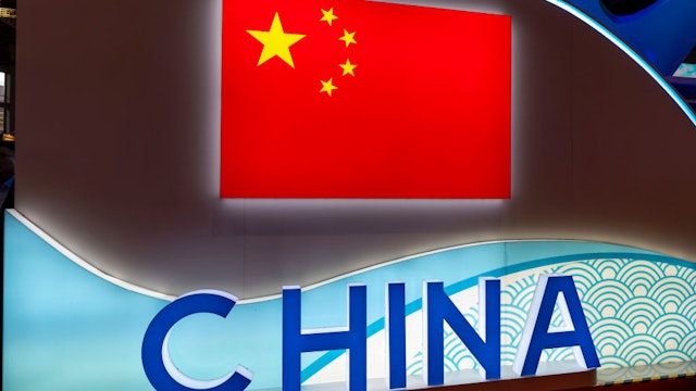 Symbol of China and China's flag are pictured during the 2nd China International Import Expo (CIIE) at the National Exhibition and Convention Center on November 6, 2019 in Shanghai, China.