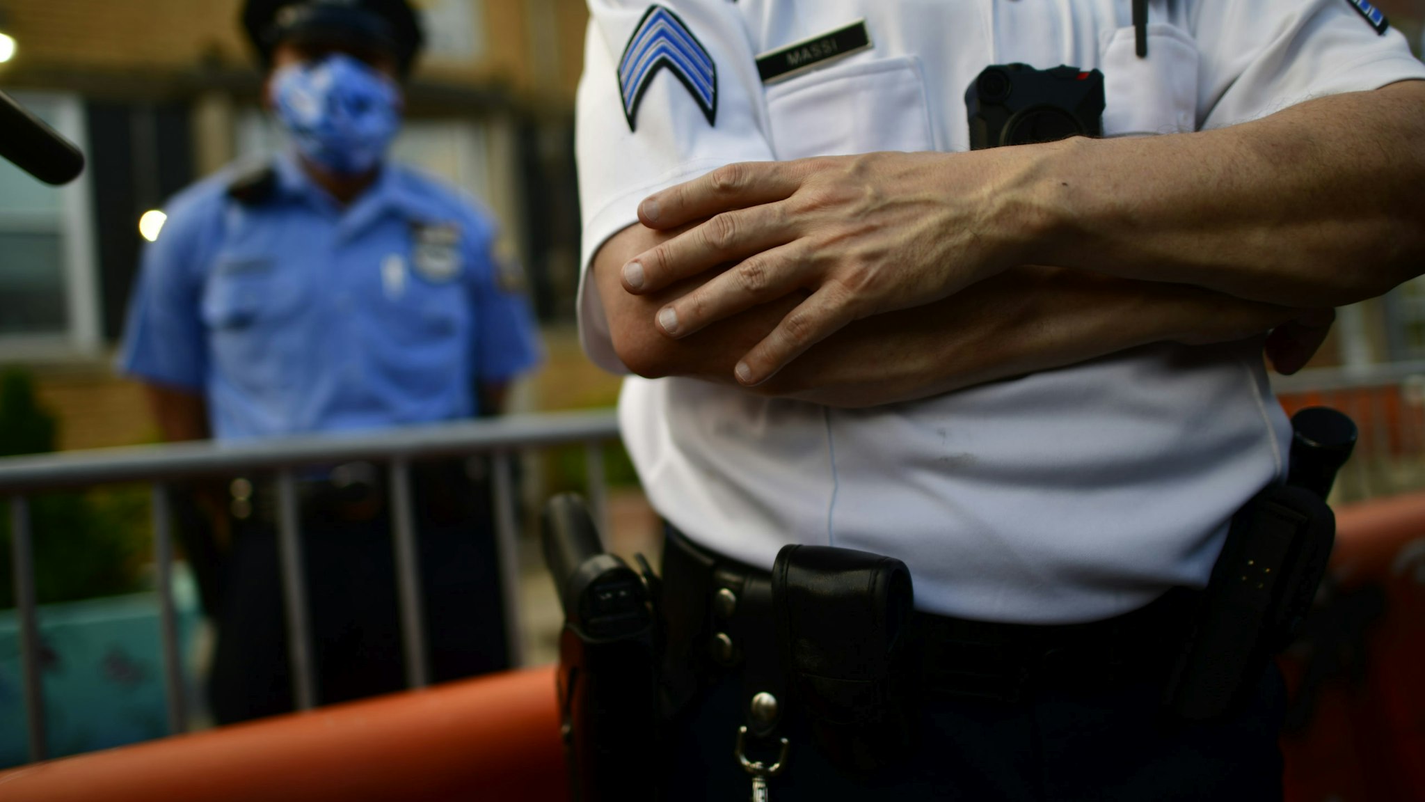 PHILADELPHIA, PA - JUNE 03: A police officer crosses his arms while observing activists gathering in protest outside the 26th Precinct on June 3, 2020 in Philadelphia, Pennsylvania. Protests continue to erupt in cities throughout the country over George Floyd, the black man who died while in police custody in Minneapolis on May 25. (Photo by Mark Makela/Getty Images)